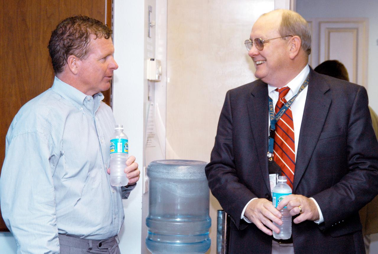 KENNEDY SPACE CENTER, FLA. - At the Beach House, Congressman Tom Feeney (left) talks with Jim Hattaway, associate director of KSC.  During January and February, Congressman Feeney traveled the entire coastline of Florida’s 24th District, and concluded his walks March 1 in Brevard County.  On his walks, he met with constituents and community leaders to discuss legislative issues that will be addressed by the 108th Congress.