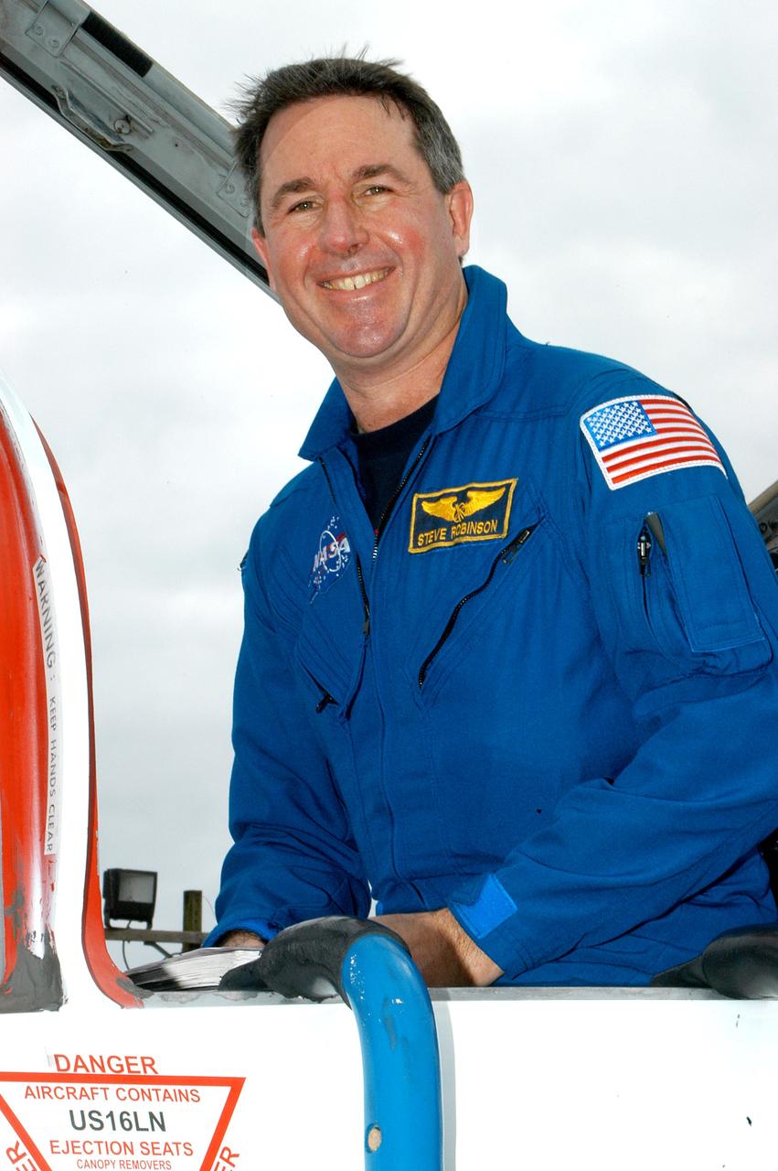 KENNEDY SPACE CENTER, FLA. - STS-114 Mission Specialist Stephen Robinson arrives at KSC aboard a T-38 jet aircraft.  He and other crew members are at the Center for familiarization activities with equipment.   The mission is Logistics Flight 1, scheduled to deliver the Multi-Purpose Logistics Module carrying supplies and equipment to the Space Station and the external stowage platform.