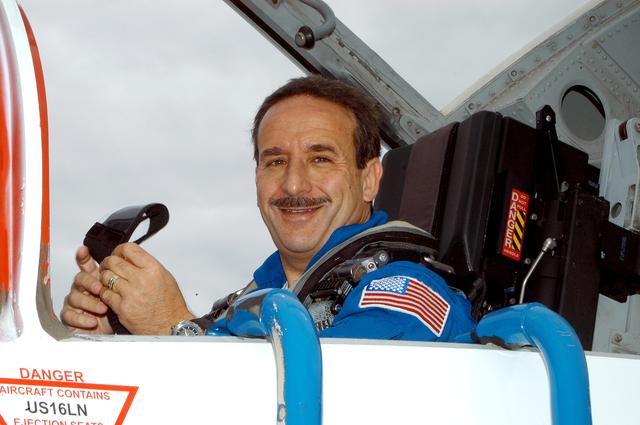 NASA image: KENNEDY SPACE CENTER, FLA. - STS-114 Mission Specialist Charles Camarda arrives at KSC aboard a T-38 jet aircraft.  He and other crew members are at the Center for familiarization activities with equipment.   The mission is Logistics Flight 1, scheduled to deliver the Multi-Purpose Logistics Module carrying supplies and equipment,to the Space Station, and the external stowage platform.