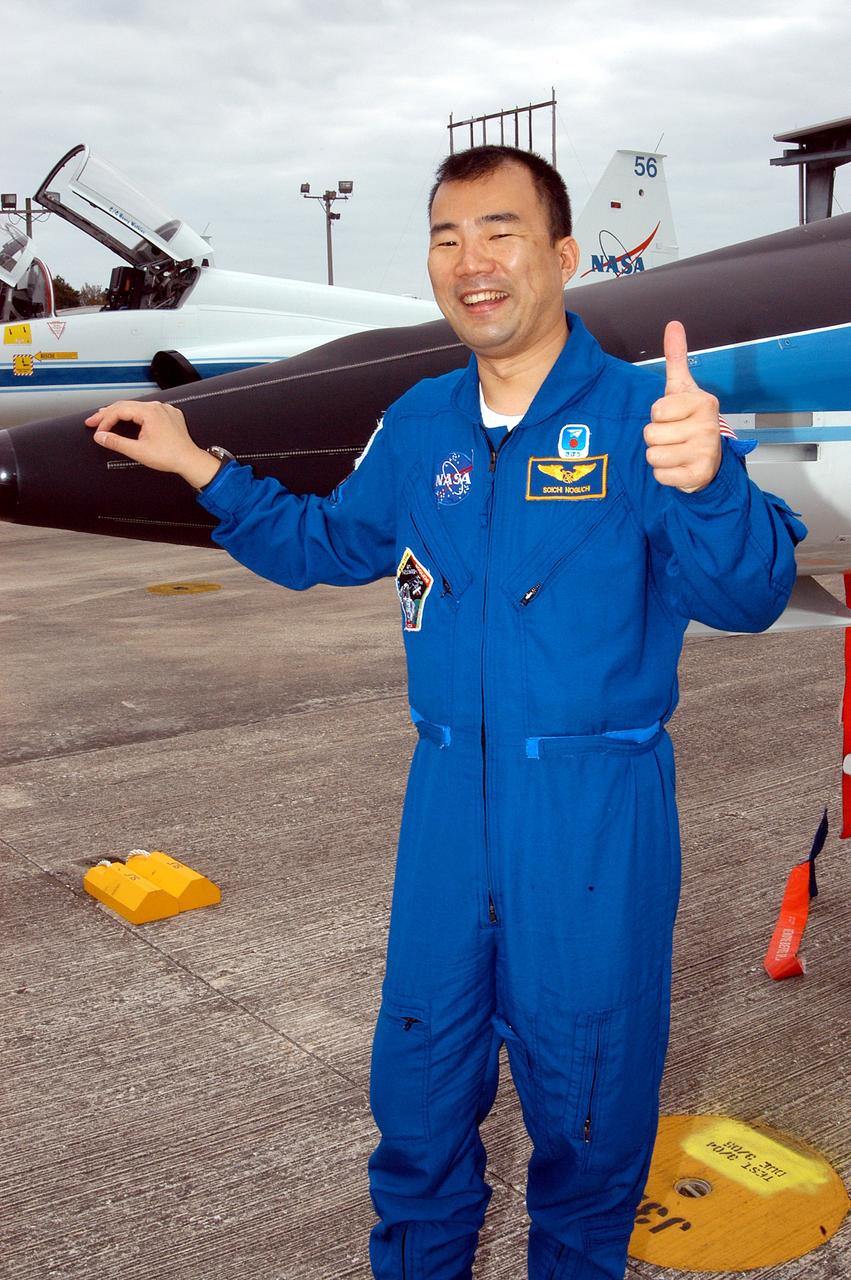 KENNEDY SPACE CENTER, FLA. - STS-114 Mission Specialist Soichi Noguchi is happy to be back at KSC after arriving aboard a T-38 jet aircraft.  He and other crew members are at the Center for familiarization activities with equipment.   The mission is Logistics Flight 1, scheduled to deliver the Multi-Purpose Logistics Module carrying supplies and equipment to the Space Station and the external stowage platform.