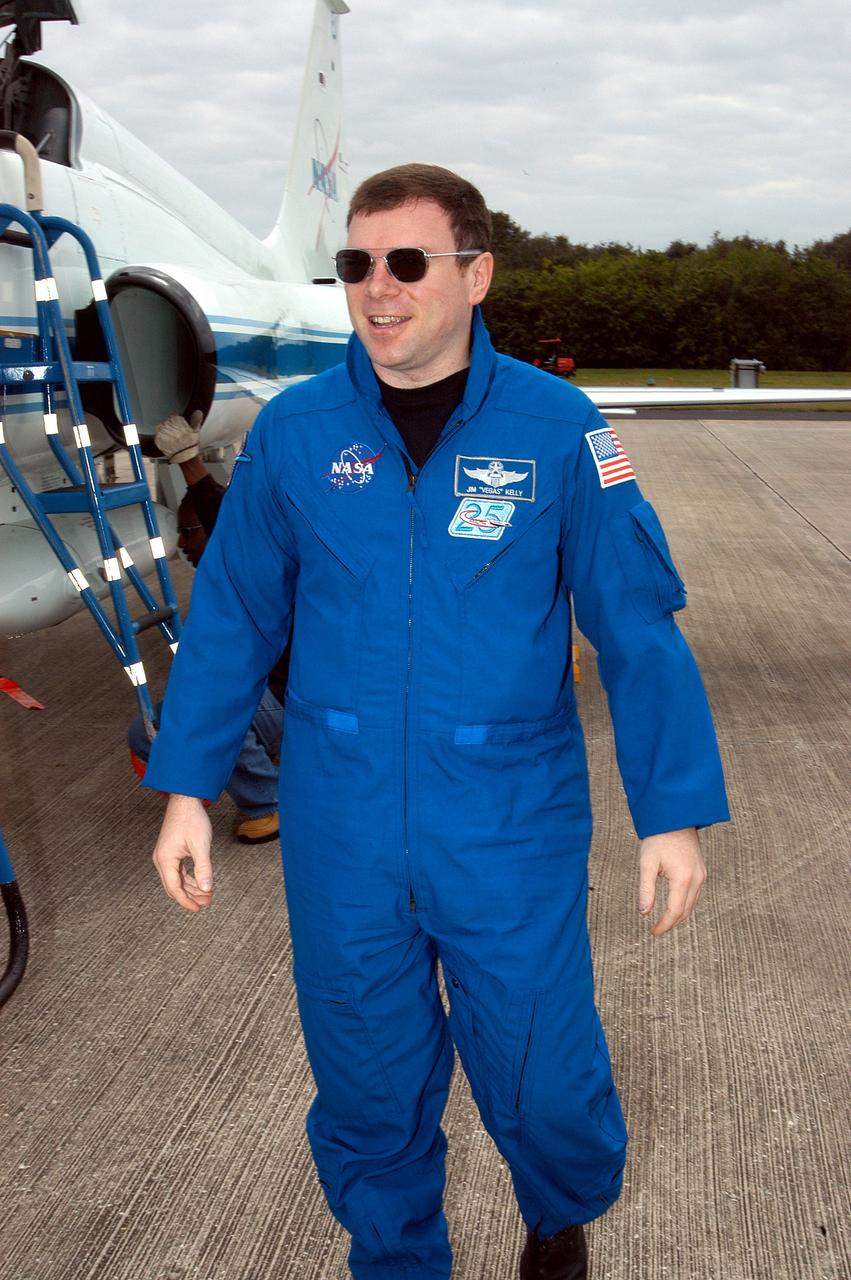 KENNEDY SPACE CENTER, FLA. - STS-114 Pilot Jim Kelly is pleased to be back at KSC after arriving aboard a T-38 jet aircraft.  He and other crew members are at the Center for familiarization activities with equipment.   The mission is Logistics Flight 1, scheduled to deliver the Multi-Purpose Logistics Module carrying supplies and equipment to the Space Station and the external stowage platform.