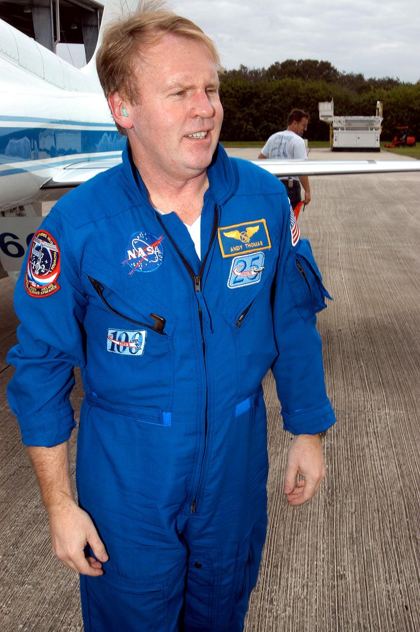 KENNEDY SPACE CENTER, FLA. - STS-114 Mission Specialist Andrew Thomas is pleased to be back at KSC after arriving aboard a T-38 jet aircraft.  He and other crew members are at the Center for familiarization activities with equipment.   The mission is Logistics Flight 1, scheduled to deliver to the Space Station the external stowage platform and the Multi-Purpose Logistics Module with supplies and equipment.