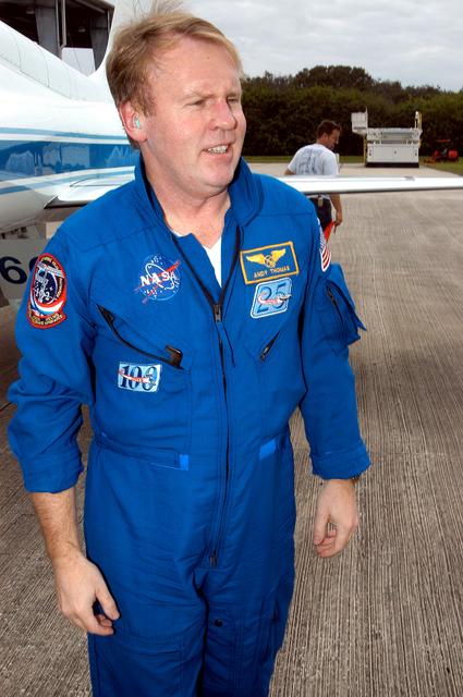 KENNEDY SPACE CENTER, FLA. - STS-114 Mission Specialist Andrew Thomas is pleased to be back at KSC after arriving aboard a T-38 jet aircraft.  He and other crew members are at the Center for familiarization activities with equipment.   The mission is Logistics Flight 1, scheduled to deliver to the Space Station the external stowage platform and the Multi-Purpose Logistics Module with supplies and equipment.