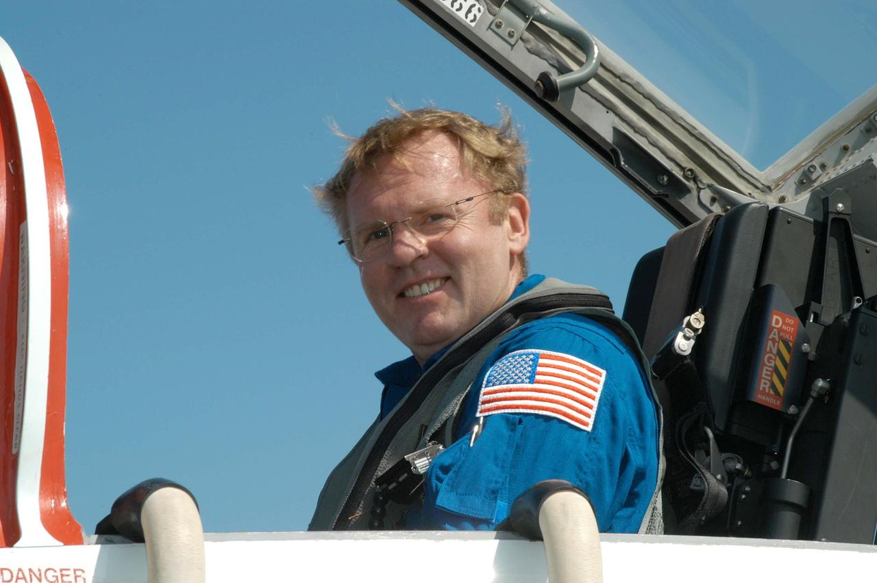 KENNEDY SPACE CENTER, FLA. - On the KSC Shuttle Landing Facility, STS-114 Mission Specialist Andrew Thomas waits in a T-38 jet aircraft for his return to Houston.  Crew members were at KSC for Shuttle and mission equipment familiarization.  The STS-114 mission is Logistics Flight 1, which is scheduled to deliver supplies and equipment, plus the external stowage platform, to the International Space Station.