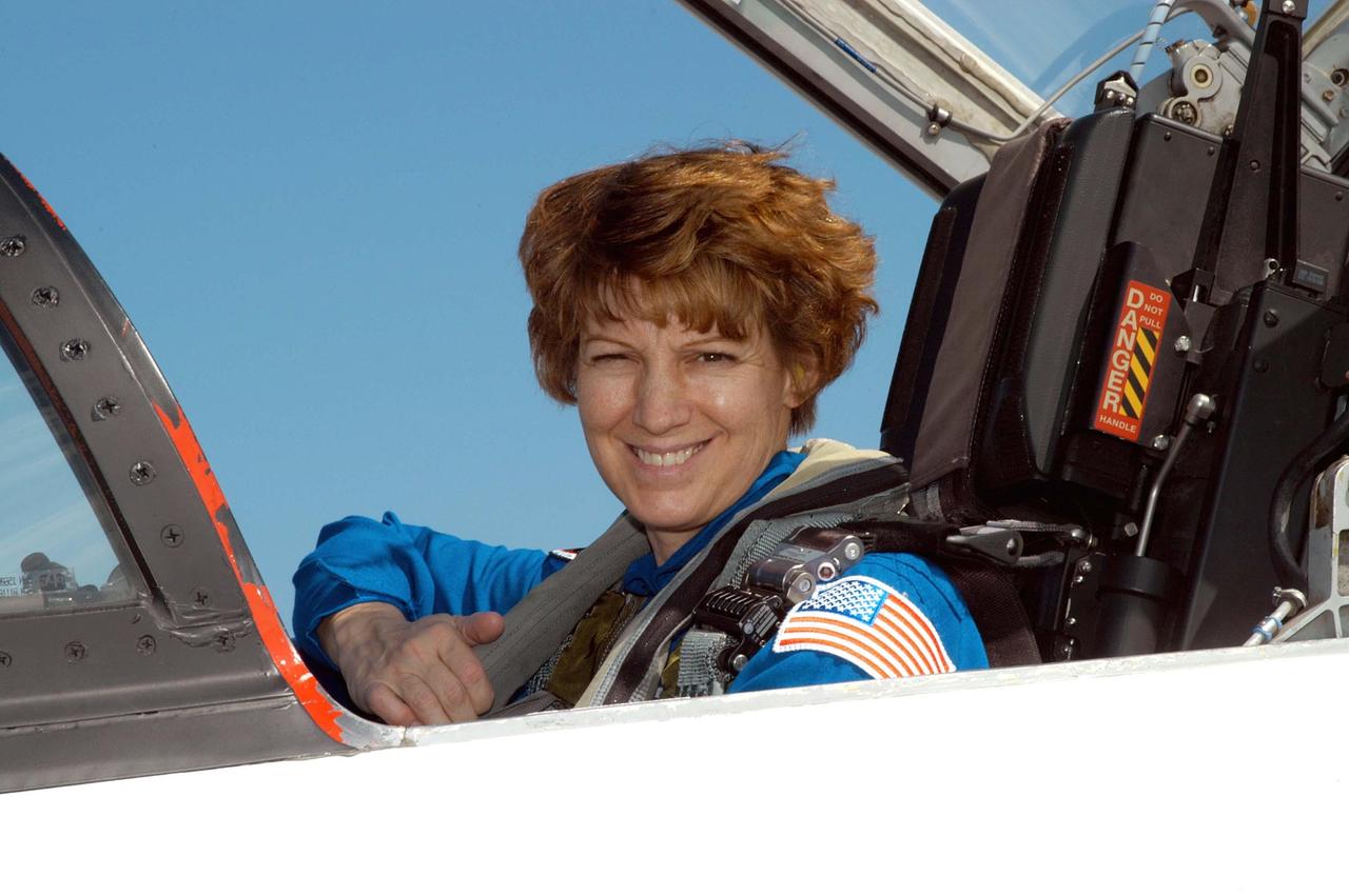 KENNEDY SPACE CENTER, FLA. - On the KSC Shuttle Landing Facility, STS-114 Commander Eileen Collins waits in a T-38 jet aircraft to return to Houston.  Crew members were at KSC for Shuttle and mission equipment familiarization.  The STS-114 mission is Logistics Flight 1, which is scheduled to deliver supplies and equipment, plus the external stowage platform, to the International Space Station.