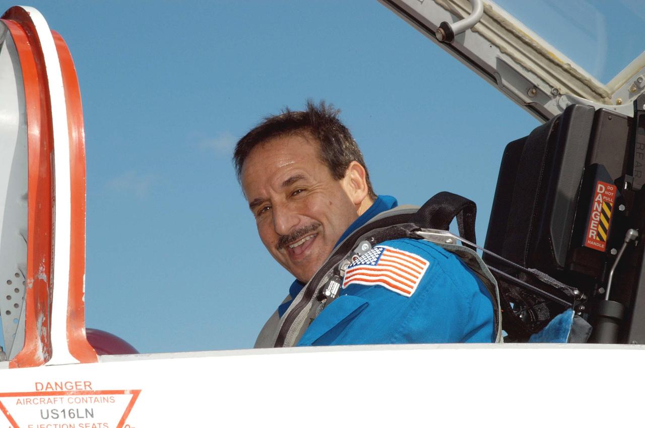 KENNEDY SPACE CENTER, FLA. - On the KSC Shuttle Landing Facility, STS-114 Mission Specialist Charles Camarda waits in a T-38 jet aircraft for his return to Houston.  Crew members were at KSC for Shuttle and mission equipment familiarization.  The STS-114 mission is Logistics Flight 1, which is scheduled to deliver supplies and equipment, plus the external stowage platform, to the International Space Station.