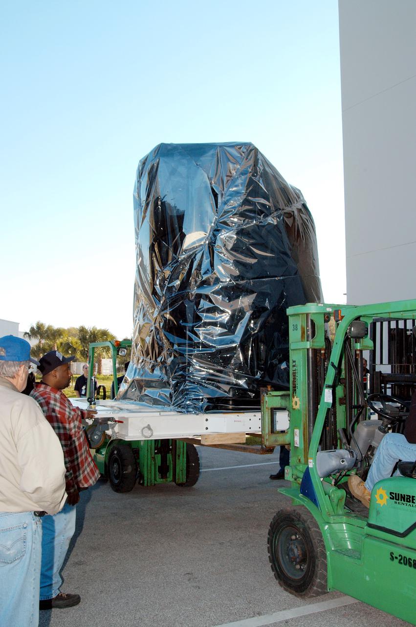 KENNEDY SPACE CENTER, FLA. -  At the Astrotech Space Operations processing facilities near KSC, a lift begins lowering NASA’s MESSENGER spacecraft onto the ground.  MESSENGER - short for MErcury Surface, Space ENvironment, GEochemistry and Ranging - will be taken into a high bay clean room and employees of the Johns Hopkins University Applied Physics Laboratory, builders of the spacecraft, will perform an initial state-of-health check.  Then processing for launch can begin, including checkout of the power systems, communications systems and control systems.  The thermal blankets will also be attached for flight.  MESSENGER will be launched May 11 on a six-year mission aboard a Boeing Delta II rocket.  Liftoff is targeted for 2:26 a.m. EDT on Tuesday, May 11.