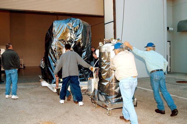 NASA image: KENNEDY SPACE CENTER, FLA. -  At the Astrotech Space Operations processing facilities near KSC, workers begin moving NASA’s MESSENGER spacecraft into the building  MESSENGER - short for MErcury Surface, Space ENvironment, GEochemistry and Ranging - is being taken into a high bay clean room where employees of the Johns Hopkins University Applied Physics Laboratory, builders of the spacecraft, will perform an initial state-of-health check.  Then processing for launch can begin, including checkout of the power systems, communications systems and control systems.  The thermal blankets will also be attached for flight.  MESSENGER will be launched May 11 on a six-year mission aboard a Boeing Delta II rocket.  Liftoff is targeted for 2:26 a.m. EDT on Tuesday, May 11.
