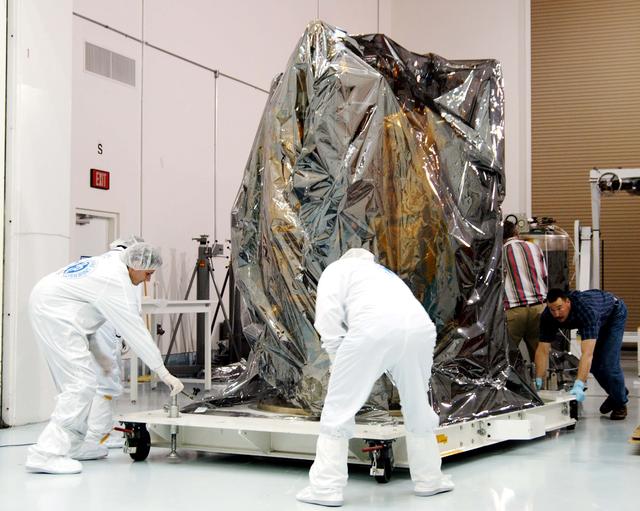 KENNEDY SPACE CENTER, FLA. -  At the Astrotech Space Operations processing facilities near KSC, workers move NASA’s MESSENGER spacecraft into a high bay clean room.  Employees of the Johns Hopkins University Applied Physics Laboratory, builders of the spacecraft, will perform an initial state-of-health check.  Then processing for launch can begin, including checkout of the power systems, communications systems and control systems.  The thermal blankets will also be attached for flight.  MESSENGER - short for MErcury Surface, Space ENvironment, GEochemistry and Ranging - will be launched May 11 on a six-year mission aboard a Boeing Delta II rocket.  Liftoff is targeted for 2:26 a.m. EDT on Tuesday, May 11.