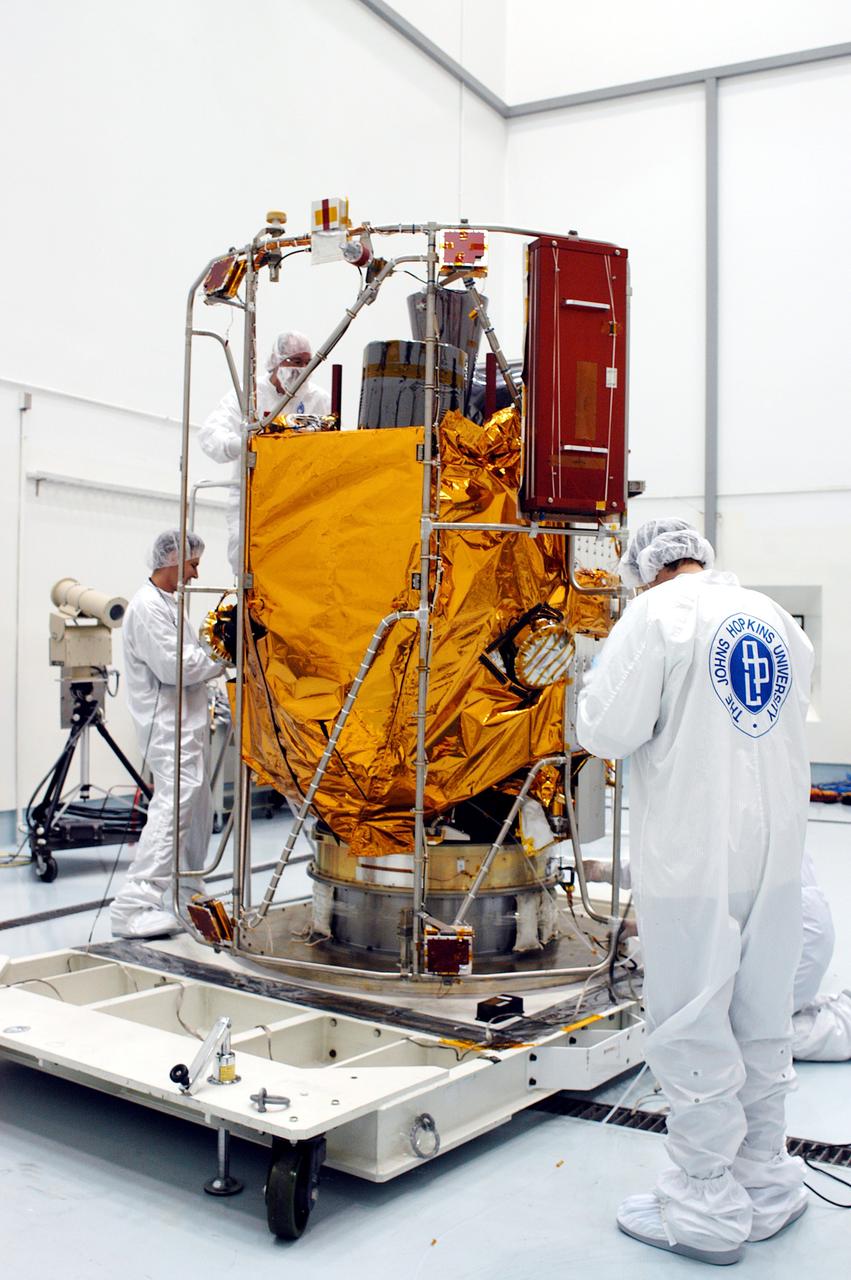 KENNEDY SPACE CENTER, FLA. -  In the high bay clean room at the Astrotech Space Operations processing facilities near KSC, NASA’s MESSENGER spacecraft is revealed.  Employees of the Johns Hopkins University Applied Physics Laboratory, builders of the spacecraft, will perform an initial state-of-health check.  Then processing for launch can begin, including checkout of the power systems, communications systems and control systems.  The thermal blankets will also be attached for flight.  MESSENGER - short for MErcury Surface, Space ENvironment, GEochemistry and Ranging - will be launched May 11 on a six-year mission aboard a Boeing Delta II rocket.  Liftoff is targeted for 2:26 a.m. EDT on Tuesday, May 11.