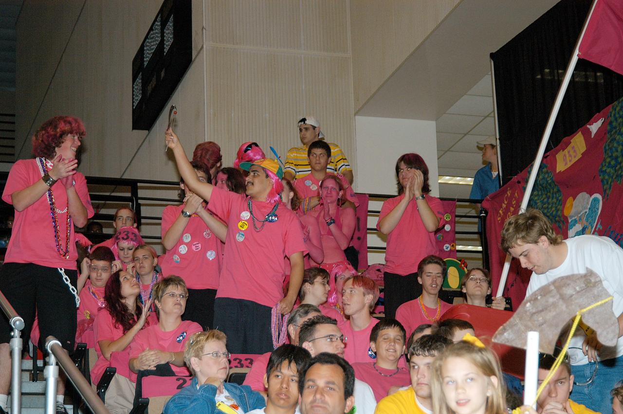 KENNEDY SPACE CENTER, FLA. -  At the University of Central Florida, friends and families  of the KSC-sponsored “Pink” team lend support from the stands during the 2004 Florida Regional FIRST competition.  The KSC team is composed of Cocoa Beach and Rockledge High School students.  The event hosted 41 teams from Canada, Brazil, Great Britain and the United States.  Among observers at the annual event were Center Director Jim Kennedy and Florida Gov. Jeb Bush, who spoke at the event luncheon.  FIRST is a nonprofit organization, For Inspiration and Recognition of Science and Technology, that sponsors the event pitting gladiator robots against each other in an athletic-style competition. The FIRST robotics competition is designed to provide students with a hands-on, inside look at engineering and other professional careers, pairing high school students with engineer mentors and corporations.