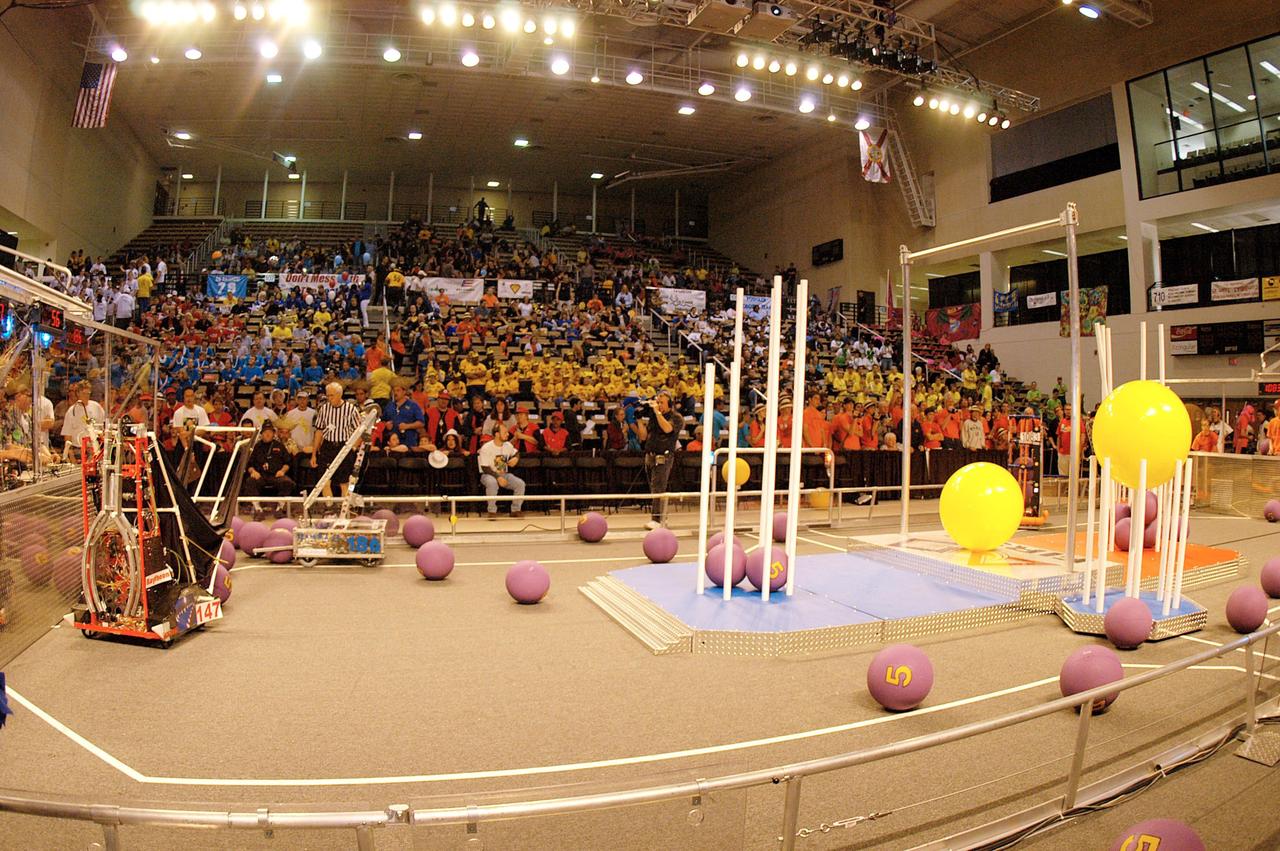 KENNEDY SPACE CENTER, FLA. -  Supporters crowd the stands to cheer for their favorite teams during the 2004 Florida Regional FIRST competition, held at the University of Central Florida Arena.  The event hosted 41 teams from Canada, Brazil, Great Britain and the United States.  Among observers at the annual event were Center Director Jim Kennedy and Florida Gov. Jeb Bush, who spoke at the event luncheon.  FIRST is a nonprofit organization, For Inspiration and Recognition of Science and Technology, that sponsors the event pitting gladiator robots against each other in an athletic-style competition. The FIRST robotics competition is designed to provide students with a hands-on, inside look at engineering and other professional careers, pairing high school students with engineer mentors and corporations.