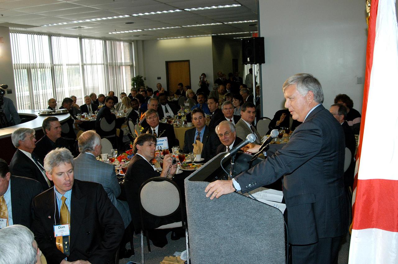 KENNEDY SPACE CENTER, FLA. -  During the luncheon held at the 2004 Florida Regional FIRST competition at the University of Central Florida, Center Director Jim Kennedy praises the teamwork of the students involved.  The event hosted 41 teams from Canada, Brazil, Great Britain and the United States.  Florida Gov. Jeb Bush also spoke at the luncheon.  FIRST is a nonprofit organization, For Inspiration and Recognition of Science and Technology, that sponsors the event pitting gladiator robots against each other in an athletic-style competition. The FIRST robotics competition is designed to provide students with a hands-on, inside look at engineering and other professional careers, pairing high school students with engineer mentors and corporations.