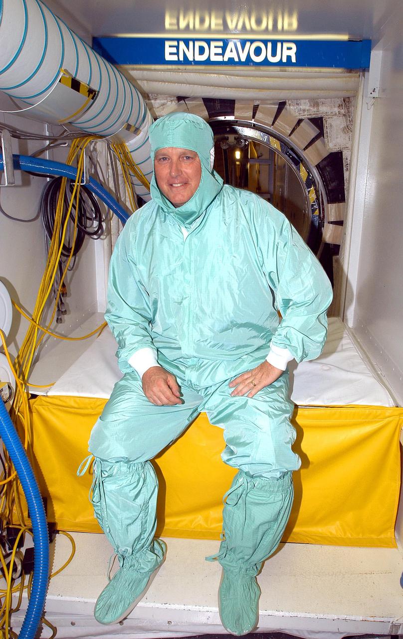 KENNEDY SPACE CENTER, FLA. -  In the Orbiter Processing Facility, Center Director Jim Kennedy pauses in his “bunny suit” -- clean room apparel -- before entering the orbiter Endeavour, which is in an Orbiter Major Modification period.  Kennedy is taking an opportunity to learn first-hand what workers are doing to enable Return to Flight.