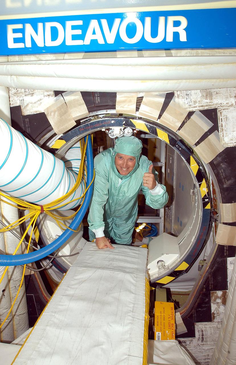KENNEDY SPACE CENTER, FLA. -  Center Director Jim Kennedy is ready to exit Endeavour after watching and talking to workers inside.  Kennedy is taking an opportunity to learn first-hand what workers are doing to enable Return to Flight.  Endeavour is in an Orbiter Major Modification period.