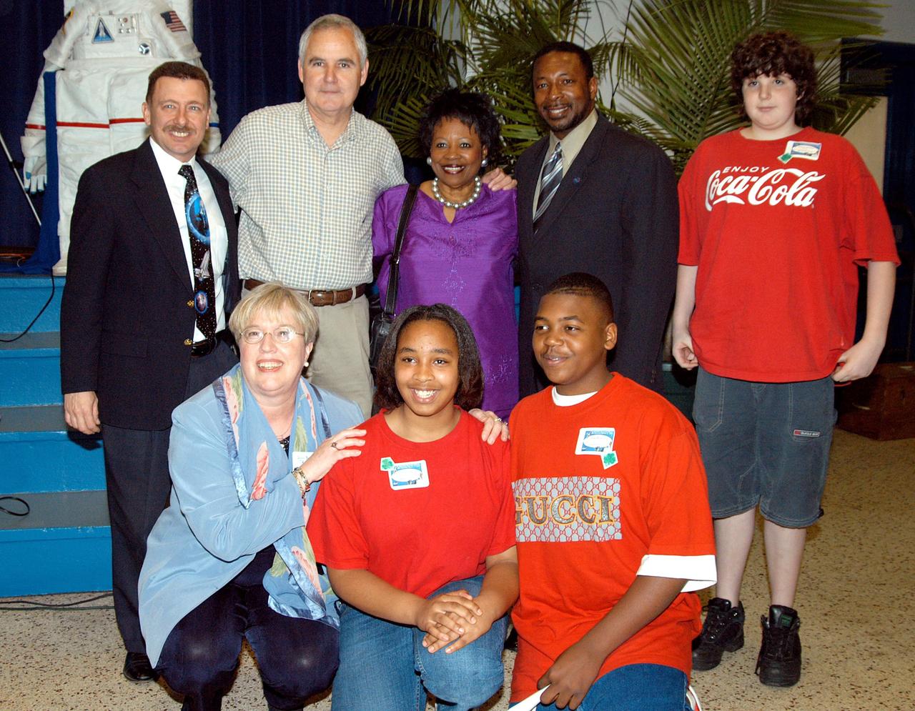 KENNEDY SPACE CENTER, FLA. - KSC Deputy Director Woodrow Whitlow Jr. (rear, second from right) poses with students and administrators at Howard Bishop Middle School in Gainesville, Fla. Dr. Whitlow shared the new vision for space exploration with the students, the next generation of explorers. Whitlow talked about our destiny as explorers, NASA’s stepping stone approach to exploring Earth, the Moon, Mars and beyond, how space impacts our lives, and how people and machines rely on each other in space. The presentation also included a downlink from the International Space Station for students to ask questions of the Expedition 8 crew, Commander Michael Foale and Flight Engineer Alexander Kaleri. Howard Bishop Middle School is one of 50 nationwide (four in Florida) in the NASA Explorer Schools (NES) Program. NES establishes a three-year partnership between NASA and 50 NASA Explorer Schools teams, consisting of teachers and education administrators from diverse communities nationwide.