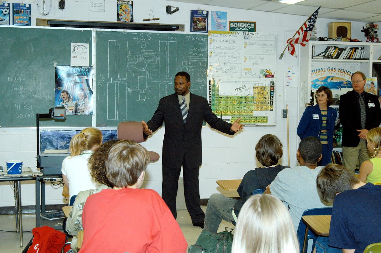 KENNEDY SPACE CENTER, FLA. - KSC Deputy Director Woodrow Whitlow Jr. talks to students in a classroom at Howard Bishop Middle School in Gainesville, Fla. Dr. Whitlow shared the new vision for space exploration with the students, the next generation of explorers. Whitlow talked about our destiny as explorers, NASA’s stepping stone approach to exploring Earth, the Moon, Mars and beyond, how space impacts our lives, and how people and machines rely on each other in space. The presentation also included a downlink from the International Space Station for students to ask questions of the Expedition 8 crew, Commander Michael Foale and Flight Engineer Alexander Kaleri. Howard Bishop Middle School is one of 50 nationwide (four in Florida) in the NASA Explorer Schools (NES) Program. NES establishes a three-year partnership between NASA and 50 NASA Explorer Schools teams, consisting of teachers and education administrators from diverse communities nationwide.