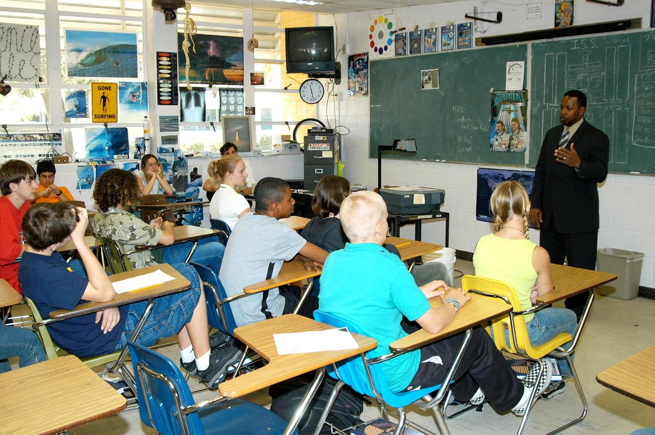 KENNEDY SPACE CENTER, FLA. - KSC Deputy Director Woodrow Whitlow Jr. talks to students in a classroom at Howard Bishop Middle School in Gainesville, Fla. Dr. Whitlow shared the new vision for space exploration with the students, the next generation of explorers. Whitlow talked about our destiny as explorers, NASA’s stepping stone approach to exploring Earth, the Moon, Mars and beyond, how space impacts our lives, and how people and machines rely on each other in space. The presentation also included a downlink from the International Space Station for students to ask questions of the Expedition 8 crew, Commander Michael Foale and Flight Engineer Alexander Kaleri. Howard Bishop Middle School is one of 50 nationwide (four in Florida) in the NASA Explorer Schools (NES) Program. NES establishes a three-year partnership between NASA and 50 NASA Explorer Schools teams, consisting of teachers and education administrators from diverse communities nationwide.