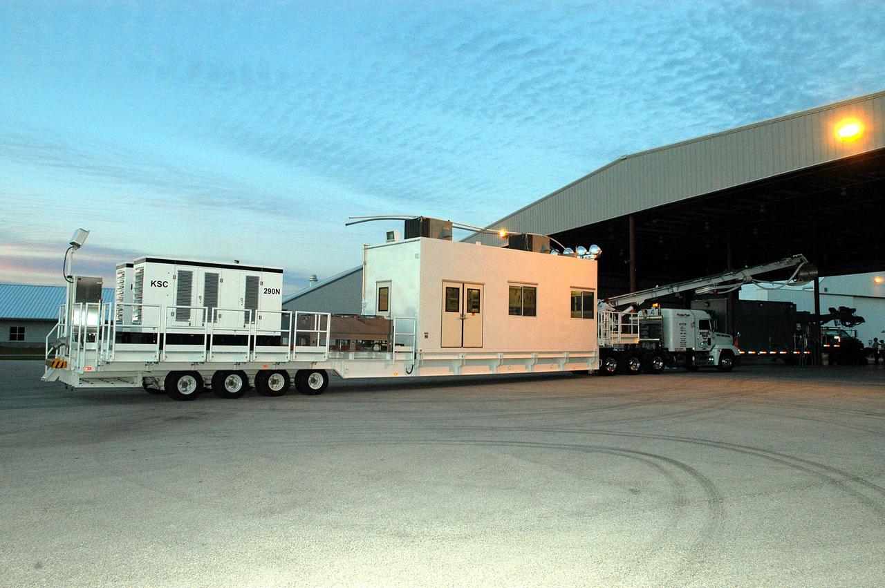 KENNEDY SPACE CENTER, FLA. -  A Universal Coolant Transporter (UCT), manufactured  in Sharpes, Fla., arrives at the hangar at the KSC Shuttle Landing Facility (SLF).  Replacing the existing ground cooling unit, the UCT is designed to service payloads for the Space Shuttle and International Space Station, and may be capable of servicing space exploration vehicles of the future.  It will provide ground cooling to the orbiter and returning payloads, such as science experiments requiring cold or freezing temperatures, during post-landing activities at the SLF and during transport of the payloads to other facilities.