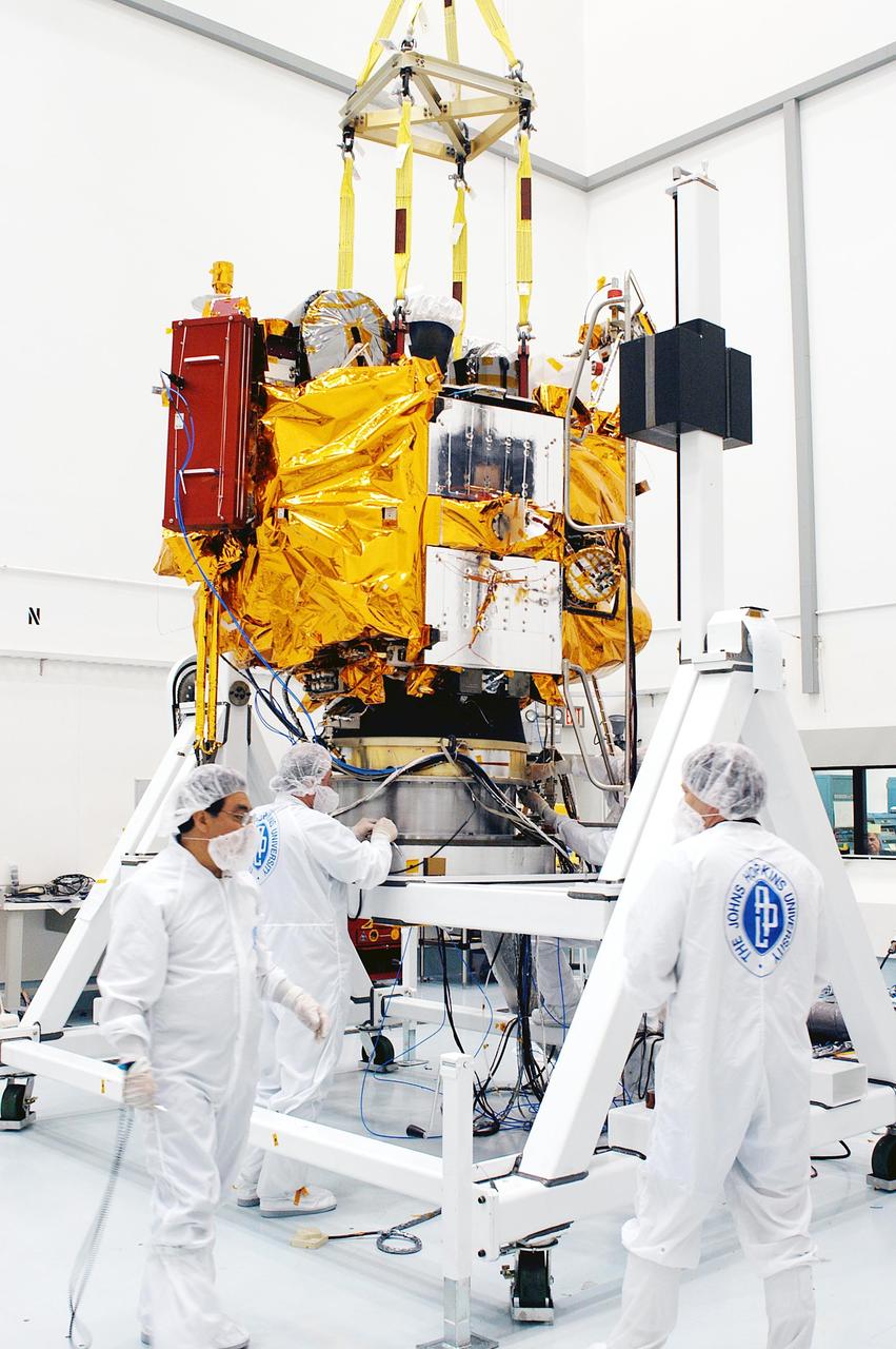 KENNEDY SPACE CENTER, FLA. -- At the Astrotech Space Operations processing facilities, workers prepare to move NASA’s MESSENGER spacecraft onto a test stand using an overhead crane. There, employees of the Johns Hopkins University Applied Physics Laboratory, builders of the spacecraft, will begin final processing for launch, including checkout of the power systems, communications systems and control systems. The thermal blankets will also be attached for flight. MESSENGER - short for MErcury Surface, Space ENvironment, GEochemistry and Ranging - will be launched aboard a Boeing Delta II rocket no earlier than July 30 on a six-year mission to study the planet Mercury.