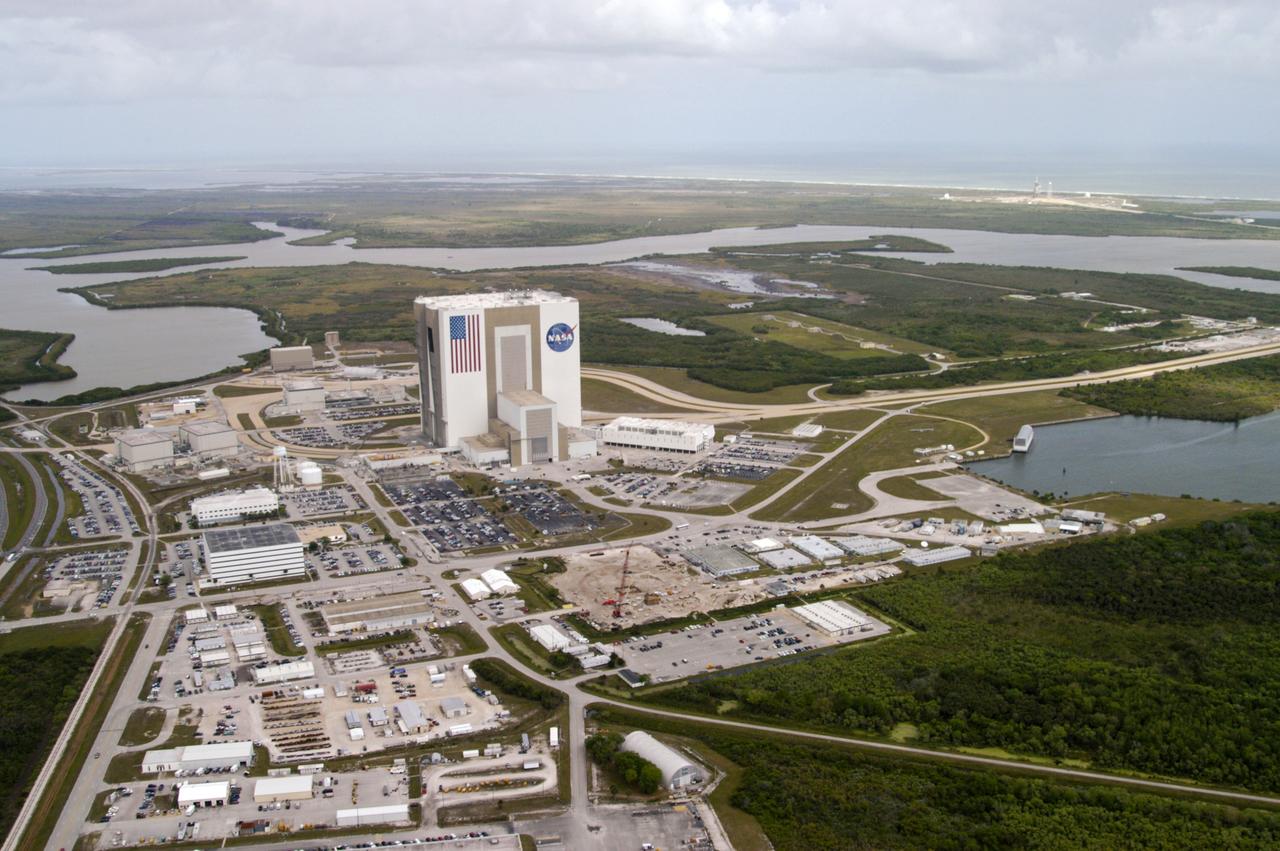 CAPE CANAVERAL, Fla. -- The 525-foot high Vehicle Assembly Building dominates the Launch Complex 39 Area.  On the right is the Launch Control Center.  Behind the VAB meanders the Banana Creek.  The two-lane crawlerway stretches from the VAB toward the coast, site of Launch Pad 39A and 39B, seen here.  The Turn Basin is at right, ending at the parking area for the NASA KSC News Center.  At center foreground is the construction area for Operations Support Building 2.          Photo credit: NASA
