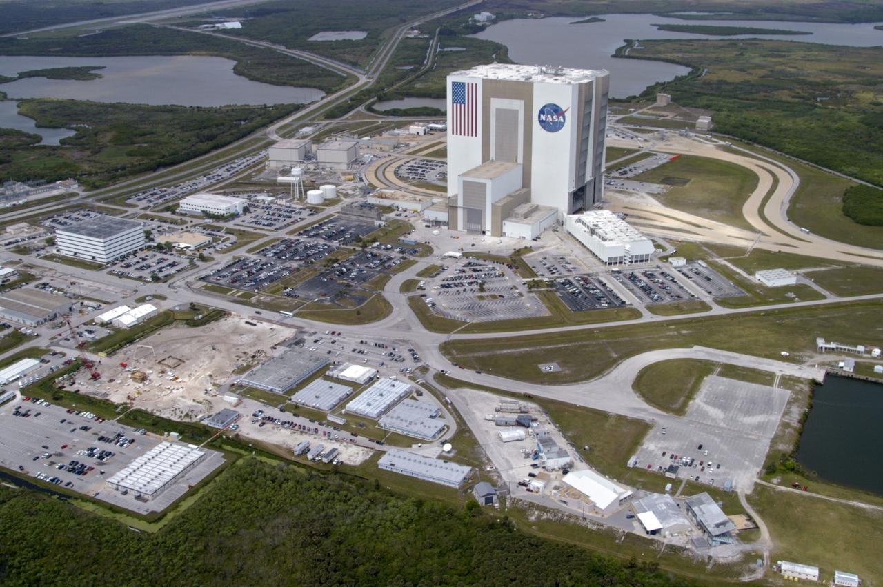 CAPE CANAVERAL, Fla. -- The 525-foot-high Vehicle Assembly Building dominates the Launch Complex 39 Area.  The major buildings surrounding it, counterclockwise, are the Orbiter Processing Facility, Operations Support Building, construction site of OSB-2, the NASA KSC News Center and Launch Control Center.          Photo credit: NASA