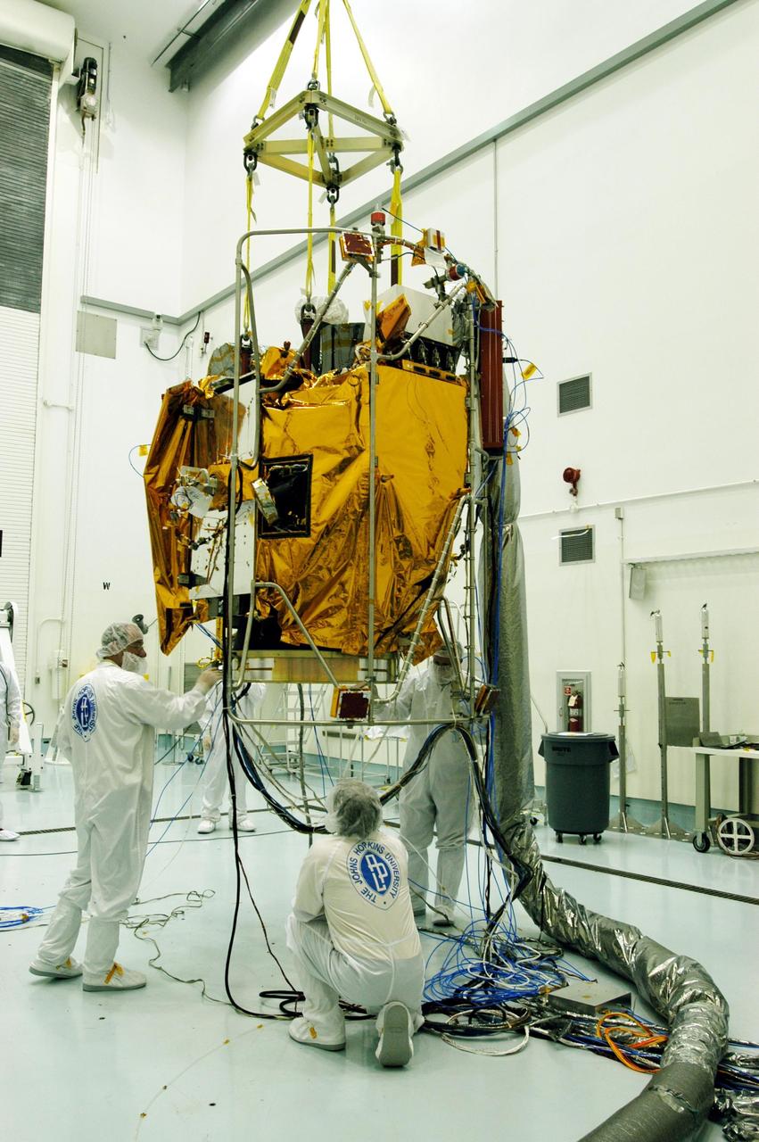 KENNEDY SPACE CENTER, FLA. -- At Astrotech Space Operations facilities near KSC, the Mercury Surface, Space Environment, Geochemistry and Ranging (MESSENGER) spacecraft is carried across the floor by an overhead crane. MESSENGER is being moved to a turnover fixture that will rotate it for prelaunch testing. Launch is scheduled for May 11 from Pad 17-B, Cape Canaveral Air Force Station. The spacecraft will fly past Venus three times and Mercury twice before starting a year-long orbital study of Mercury in July 2009.
