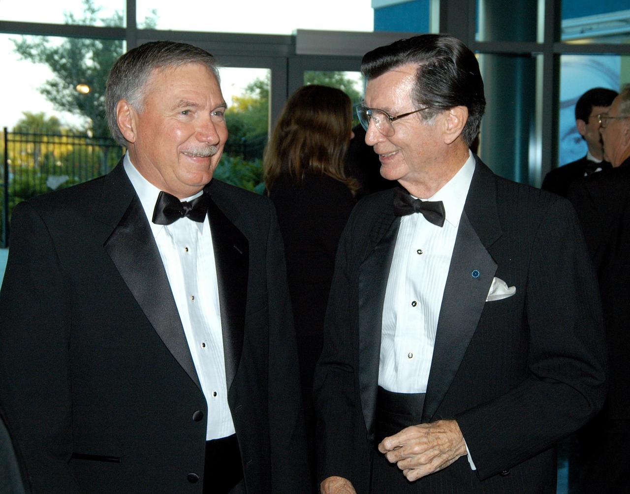 KENNEDY SPACE CENTER, FLA. -- John J. “Tip” Talone (left) talks to George English, former director of KSC’s Executive Management Office, during the annual National Space Club Debus Award Banquet. Talone received the award that was created to recognize significant achievements made in Florida to American aerospace efforts. The event was held at the Dr. Kurt H. Debus Conference Facility in the Visitor Complex. Talone is director of the International Space Station/Payloads Processing directorate at KSC that is responsible for prelaunch and launch preparations for all Shuttle payloads. He was honored for his outstanding personal and professional efforts in supporting the U.S. space program, especially in his current role. The award was created by the National Space Club Florida Committee to recognize significant achievements and contributions made in Florida to American aerospace efforts. It is named for Dr. Kurt H. Debus, first director of KSC, from 1962 to 1974.