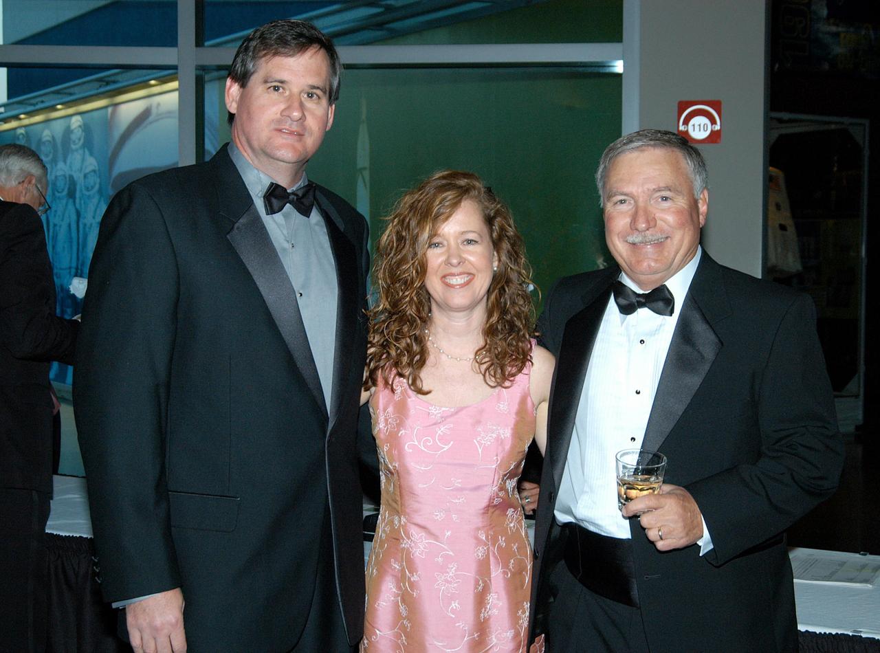 KENNEDY SPACE CENTER, FLA. -- John J. “Tip” Talone (right) poses with Lisa Malone, director of KSC External Affairs, and Kevin Hoshstrasser, her fiancé, during the annual National Space Club Debus Award Banquet. Talone received the award that was created to recognize significant achievements made in Florida to American aerospace efforts. The event was held at the Dr. Kurt H. Debus Conference Facility in the Visitor Complex. Talone is director of the International Space Station/Payloads Processing directorate at KSC that is responsible for prelaunch and launch preparations for all Shuttle payloads. He was honored for his outstanding personal and professional efforts in supporting the U.S. space program, especially in his current role. The award was created by the National Space Club Florida Committee to recognize significant achievements and contributions made in Florida to American aerospace efforts. It is named for Dr. Kurt H. Debus, first director of KSC, from 1962 to 1974.