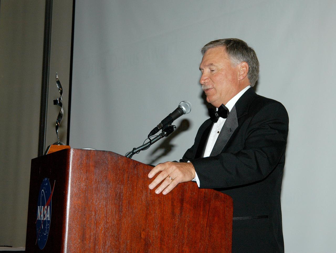 KENNEDY SPACE CENTER, FLA. -- Debus Award recipient John J. “Tip” Talone speaks to guests at the annual National Space Club Debus Award Banquet, held at the Dr. Kurt H. Debus Conference Facility in the Visitor Complex. Talone, director of the International Space Station/Payloads Processing directorate, received the award in recognition of his outstanding personal and professional efforts in supporting the U.S. space program, especially in his current role. The award was created by the National Space Club Florida Committee to recognize significant achievements and contributions made in Florida to American aerospace efforts. It is named for Dr. Kurt H. Debus, first director of KSC, from 1962 to 1974.
