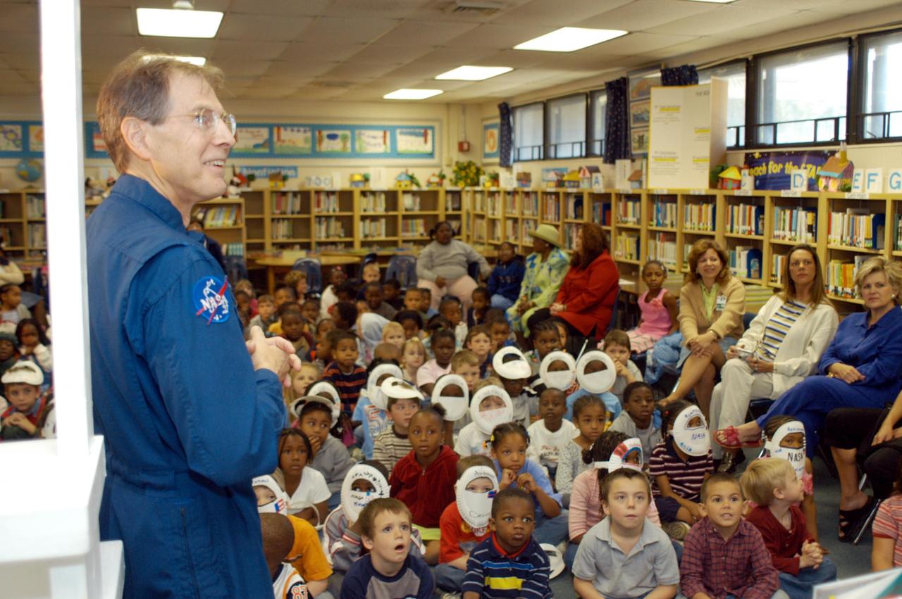 KENNEDY SPACE CENTER, FLA. -- Astronaut Sam Durrance shares stories of his experiences as an astronaut with enthralled students in a classroom at Oscar Patterson Elementary Magnet School in Panama City, Fla.  Durrance joined Center Director Jim Kennedy, who is visiting  Florida and Georgia NASA Explorer Schools to share America’s new vision for space exploration with the next generation of explorers.  Kennedy is talking with students about our destiny as explorers, NASA’s stepping stone approach to exploring Earth, the Moon, Mars and beyond, how space impacts our lives, and how people and machines rely on each other in space.