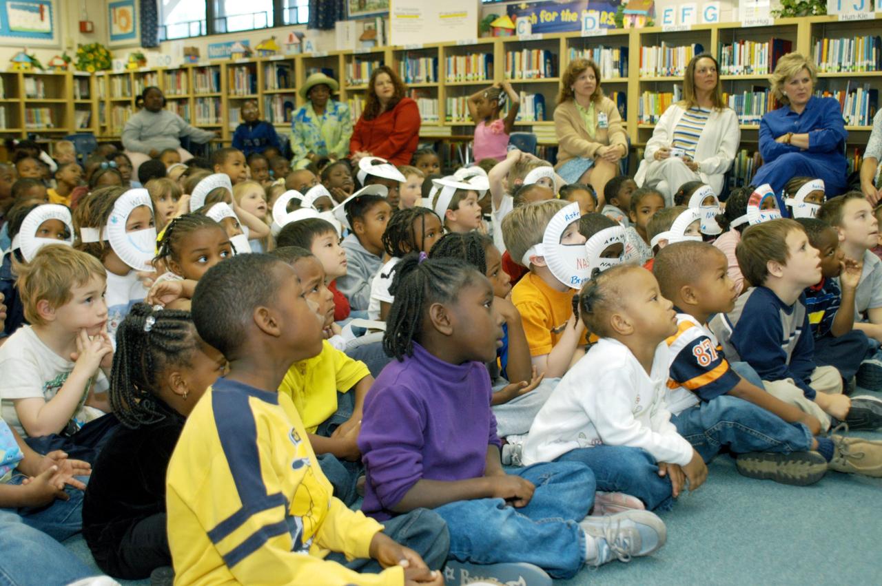 KENNEDY SPACE CENTER, FLA. -- Enthralled students in a classroom at Oscar Patterson Elementary Magnet School in Panama City, Fla., listen to astronaut Sam Durrance as he shares stories of his experiences as an astronaut.  Durrance joined Center Director Jim Kennedy, who is visiting  Florida and Georgia NASA Explorer Schools to share America’s new vision for space exploration with the next generation of explorers.  Kennedy is talking with students about our destiny as explorers, NASA’s stepping stone approach to exploring Earth, the Moon, Mars and beyond, how space impacts our lives, and how people and machines rely on each other in space.