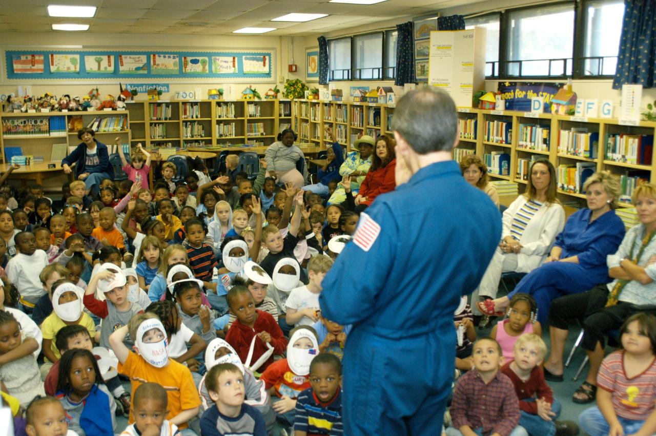 KENNEDY SPACE CENTER, FLA. -- Students in a classroom at Oscar Patterson Elementary Magnet School in Panama City, Fla., are eager to ask questions of astronaut Sam Durrance, who was sharing stories of his experiences as an astronaut.  Durrance joined Center Director Jim Kennedy, who is visiting  Florida and Georgia NASA Explorer Schools to share America’s new vision  for space exploration with the next generation of explorers.  Kennedy is talking with students about our destiny as explorers, NASA’s stepping stone approach to exploring Earth, the Moon, Mars and beyond, how space impacts our lives, and how people and machines rely on each other in space.