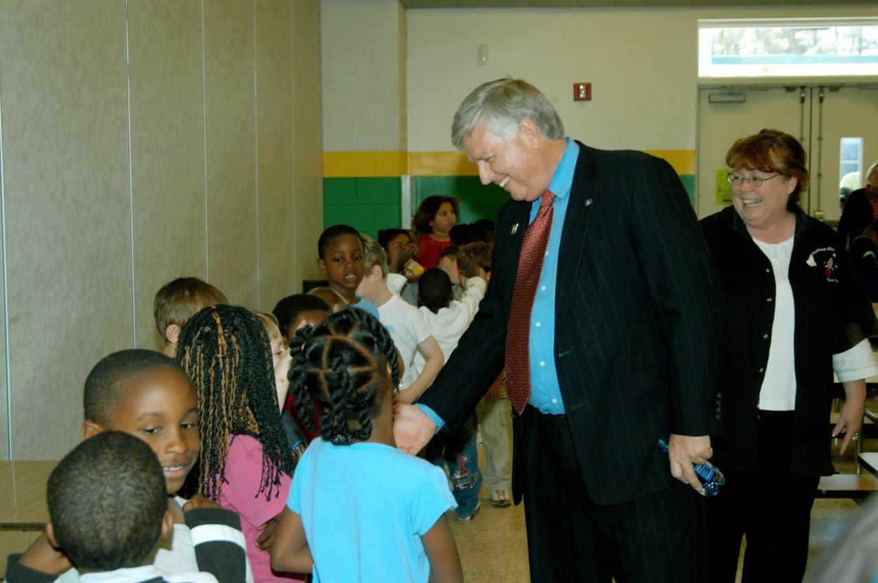 KENNEDY SPACE CENTER, FLA. -- Center Director Jim Kennedy shakes hands with students at Oscar Patterson Elementary Magnet School in Panama City, Fla.  Kennedy is touring Florida and Georgia NASA Explorer Schools to share America’s new vision for space exploration with the next generation of explorers.  Kennedy is talking with students about our destiny as explorers, NASA’s stepping stone approach to exploring Earth, the Moon, Mars and beyond, how space impacts our lives, and how people and machines rely on each other in space.