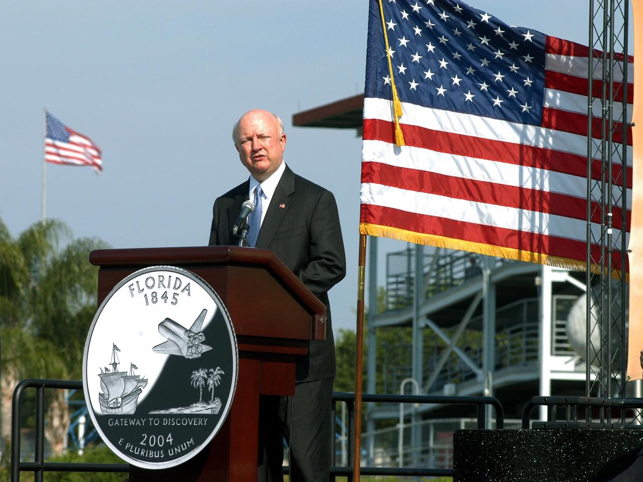 KENNEDY SPACE CENTER, FLA. -- Deputy Secretary of the Treasury Samuel W. Bodman remarks on the design of the new Florida quarter at a ceremony for its unveiling, held at the KSC Visitor Complex. The quarter celebrates Florida as the gateway to discovery -- a destination for explorers in the past, a launch site for space explorers of the future, and an inviting place for visitors today.