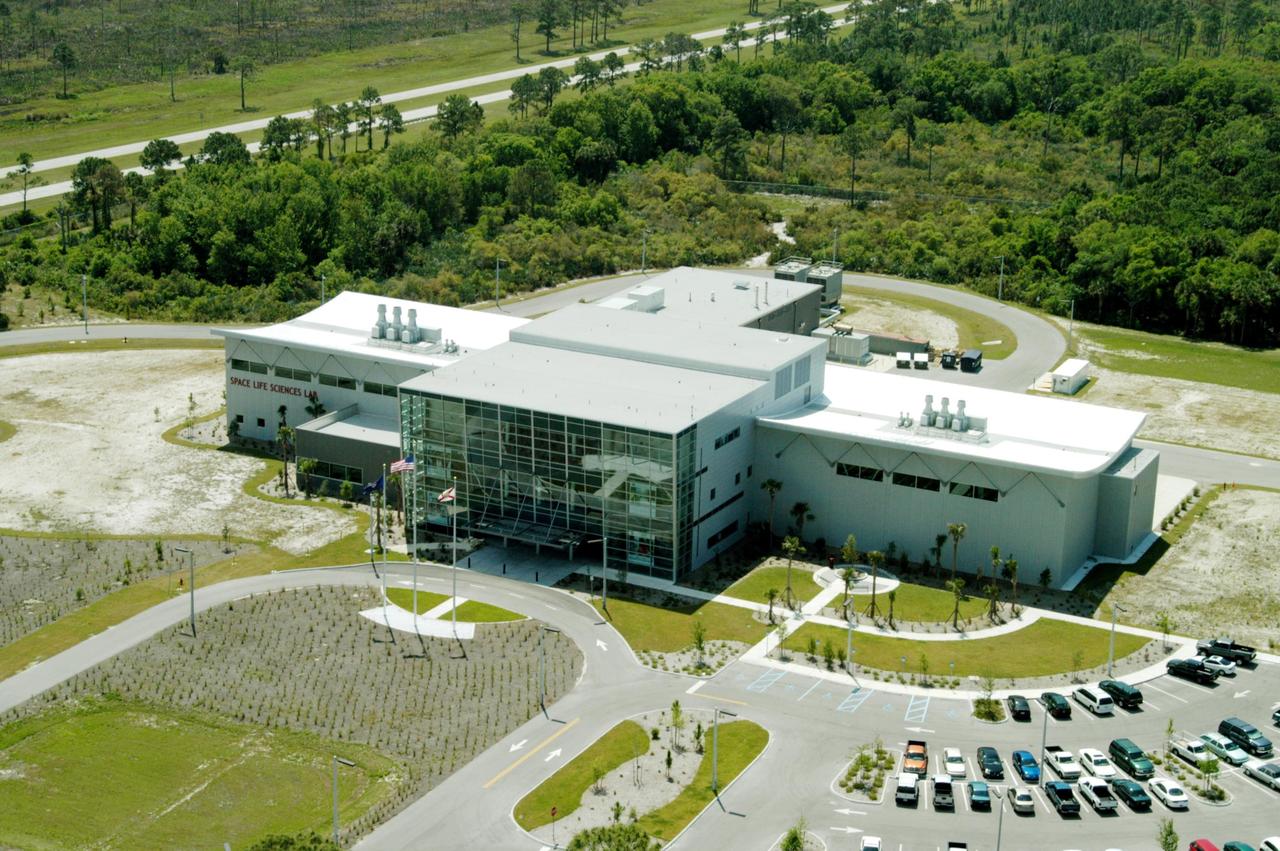 KENNEDY SPACE CENTER, FLA. --  An aerial photo of the recently completed Space Life Sciences Lab at KSC.  The new lab is a state-of-the-art facility built for ISS biotechnology research. It was developed as a partnership between NASA-KSC and the State of Florida.  The Lab was the site of a tour by Florida Gov. Jeb Bush, NASA Administrator Sean O’Keefe, Center Director Jim Kennedy, U.S. Mint Director Henrietta Holsman Fore and Deputy Secretary of the Treasury Samuel W. Bodman.  The tour followed the launching ceremony at the KSC Visitor Complex for the new Florida quarter issued by the U.S. Mint. The ceremony was emceed by Kennedy and included remarks by O’Keefe, Bush, Fore and Bodman.