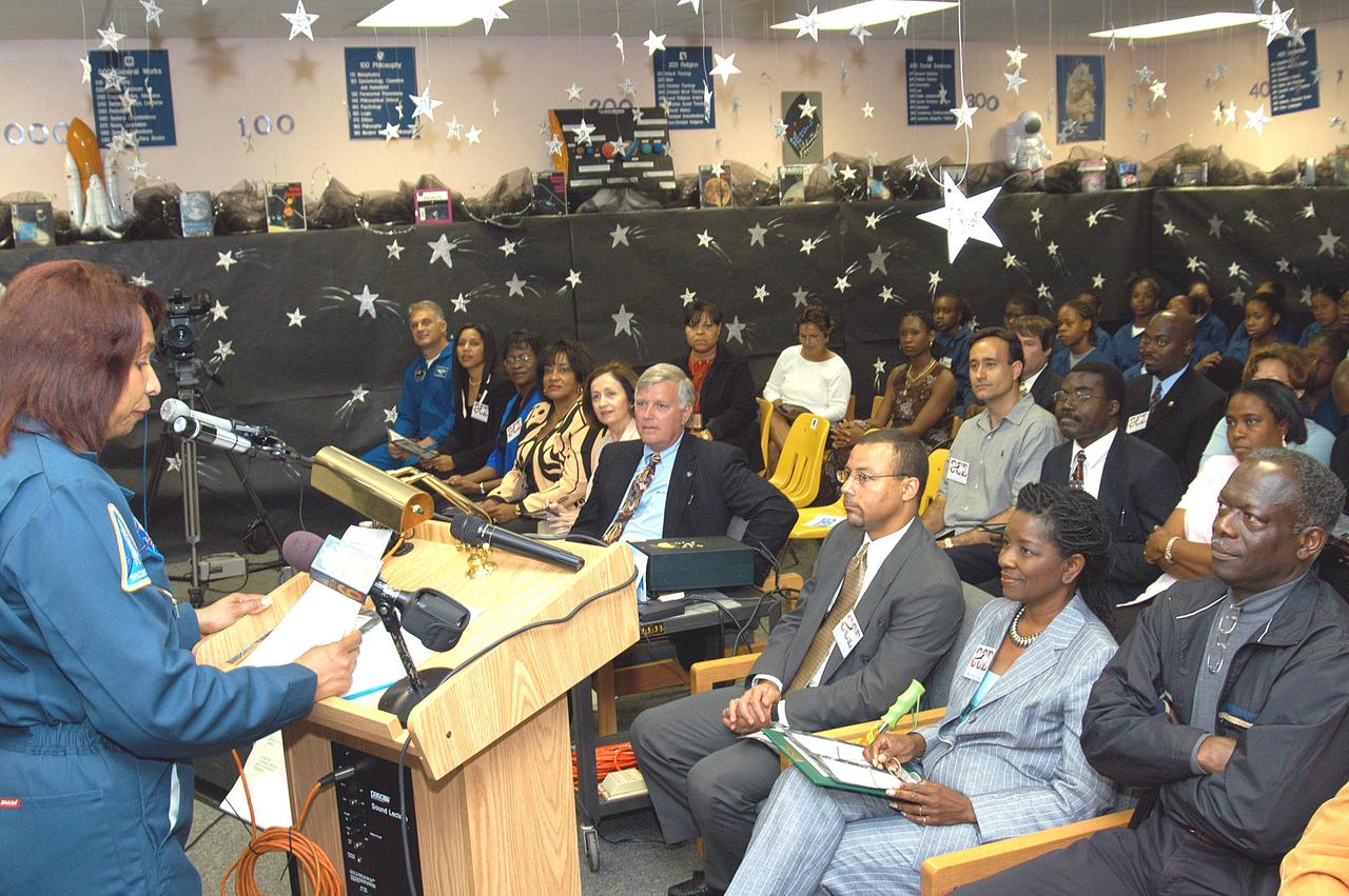 KENNEDY SPACE CENTER, FLA. - Claudia Hessing, the principal of Carol City Elementary School, a NASA Explorer School, in Miami, Fla., introduces NASA guests in the front left row, Center Director Jim Kennedy (center) and astronaut Dr. David A. Wolf (far left). Kennedy made the tour to share America’s new vision for space exploration with the next generation of explorers. He was accompanied by astronaut Dr. David A. Wolf. Kennedy is talking with students about our destiny as explorers, NASA’s stepping stone approach to exploring Earth, the Moon, Mars and beyond, how space impacts our lives, and how people and machines rely on each other in space.