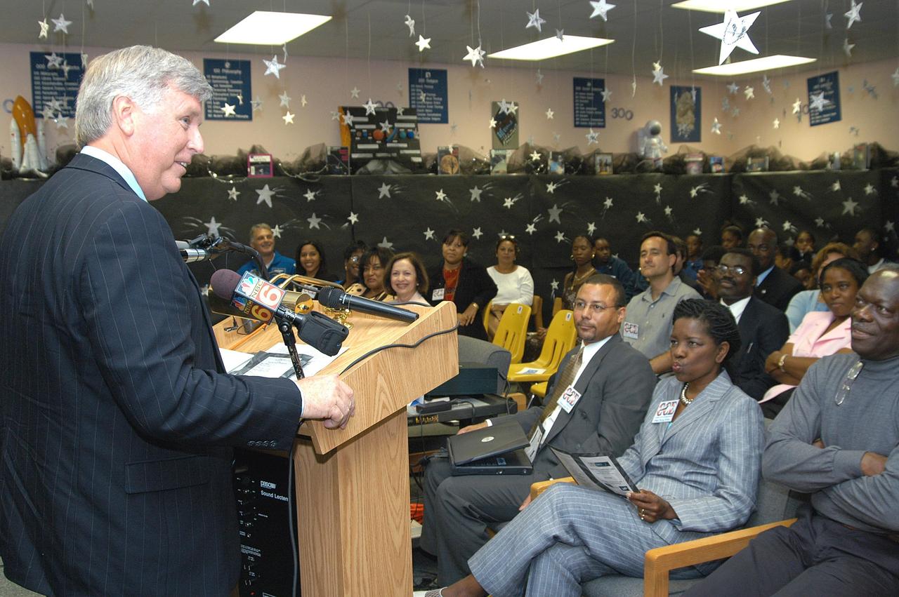 KENNEDY SPACE CENTER, FLA. - Center Director Jim Kennedy (left) speaks to students, faculty and guests at Carol City Elementary School, a NASA Explorer School, in Miami, Fla. Kennedy made the tour to share America’s new vision for space exploration with the next generation of explorers. He was accompanied by astronaut Dr. David A. Wolf. Kennedy is talking with students about our destiny as explorers, NASA’s stepping stone approach to exploring Earth, the Moon, Mars and beyond, how space impacts our lives, and how people and machines rely on each other in space.