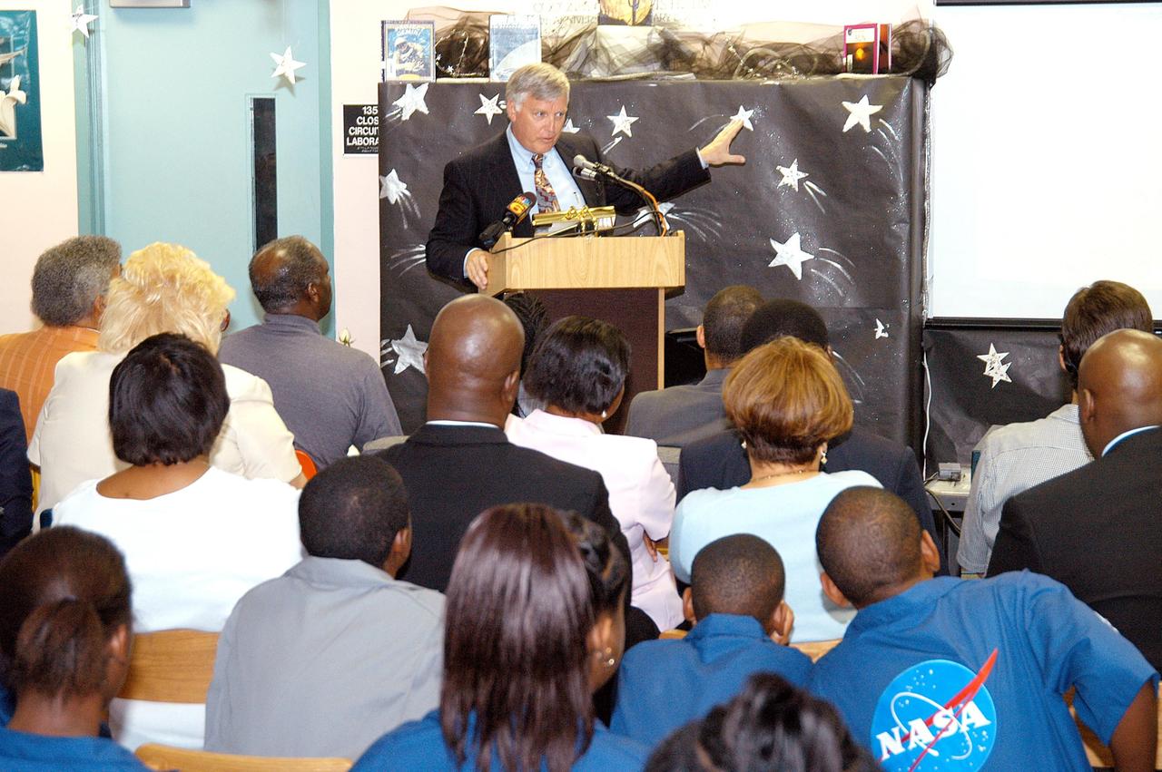 KENNEDY SPACE CENTER, FLA. - Center Director Jim Kennedy speaks to students, faculty and guests at Carol City Elementary School, a NASA Explorer School, in Miami, Fla. Kennedy made the tour to share America’s new vision for space exploration with the next generation of explorers. He was accompanied by astronaut Dr. David A. Wolf. Kennedy is talking with students about our destiny as explorers, NASA’s stepping stone approach to exploring Earth, the Moon, Mars and beyond, how space impacts our lives, and how people and machines rely on each other in space.