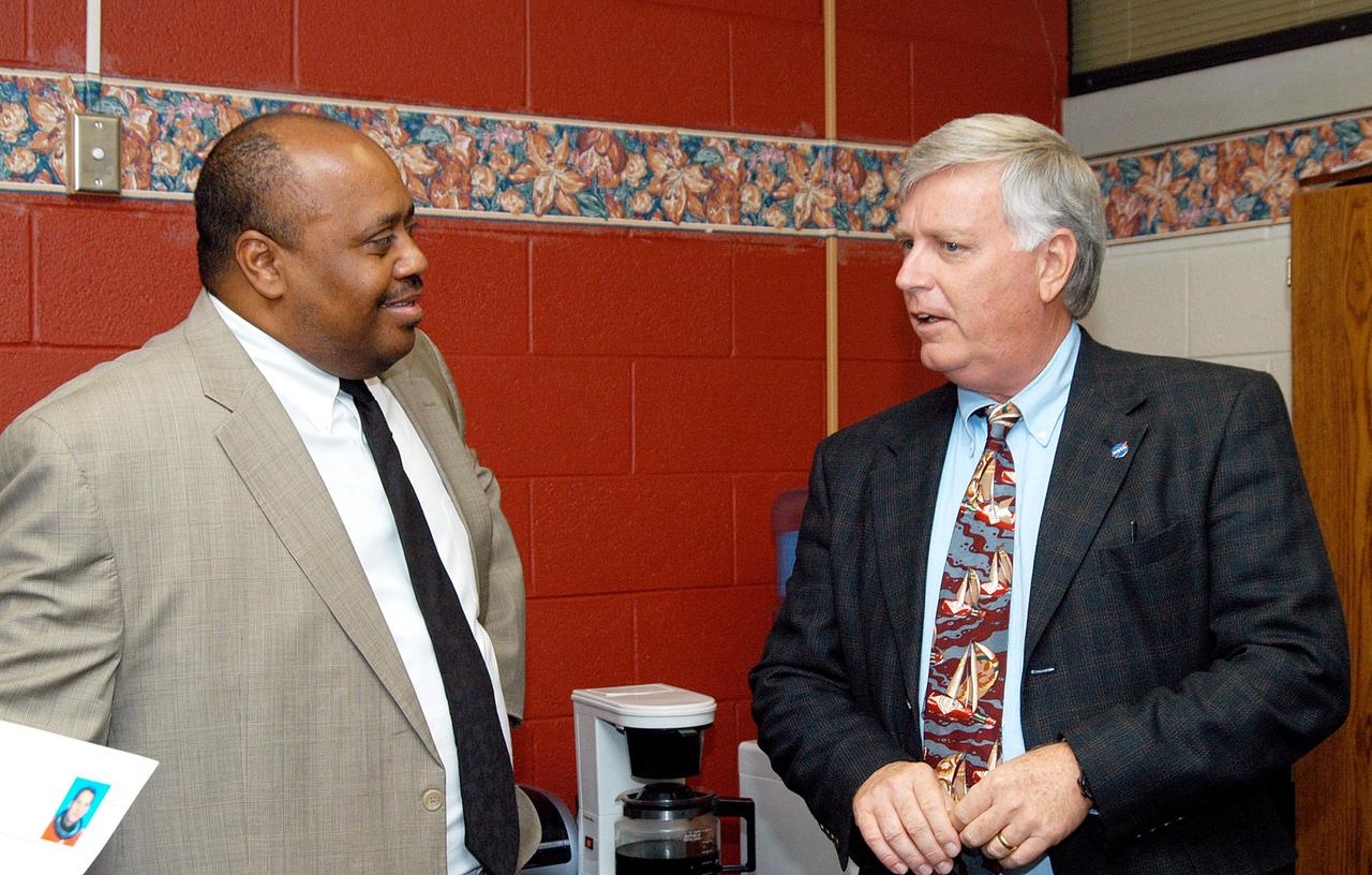 KENNEDY SPACE CENTER, FLA. -  Center Director Jim Kennedy (right) talks to Aaron Fernander, principal of Ralph Bunche Middle School, a NASA Explorer School, in Atlanta, Ga.  Kennedy is visiting NES sites to share America’s new vision for space exploration with the next generation of explorers. He was accompanied by astronaut Rick Linnehan on the visit.  The purpose of the school visit is to talk with students about our destiny as explorers, NASA’s stepping stone approach to exploring Earth, the Moon, Mars and beyond, how space impacts our lives, and how people and machines rely on each other in space.