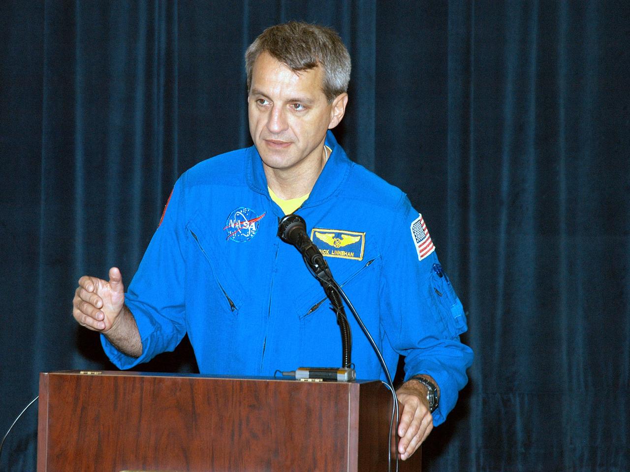 KENNEDY SPACE CENTER, FLA. -  Astronaut Rick Linnehan talks to students and faculty at Ralph Bunche Middle School, a NASA Explorer School, in Atlanta, Ga.  Linnehan accompanied Center Director Jim Kennedy, who is visiting NES sites to share America’s new vision for space exploration with the next generation of explorers.  The purpose of the school visit is to talk with students about our destiny as explorers, NASA’s stepping stone approach to exploring Earth, the Moon, Mars and beyond, how space impacts our lives, and how people and machines rely on each other in space.