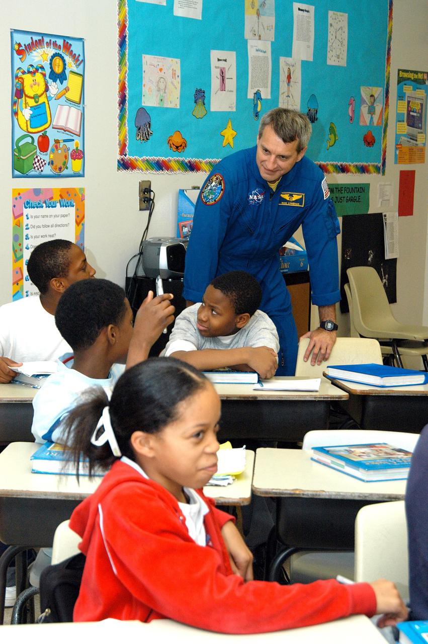 KENNEDY SPACE CENTER, FLA. -  Astronaut Rick Linnehan talks to students in a classroom at Ralph Bunche Middle School, a NASA Explorer School, in Atlanta, Ga.  Linnehan accompanied Center Director Jim Kennedy, who was visiting the school to share America’s new vision for space exploration with the next generation of explorers.  The visit is one of many Kennedy has made to NES sites in Florida and Georgia to talk with students about our destiny as explorers, NASA’s stepping stone approach to exploring Earth, the Moon, Mars and beyond, how space impacts our lives, and how people and machines rely on each other in space.