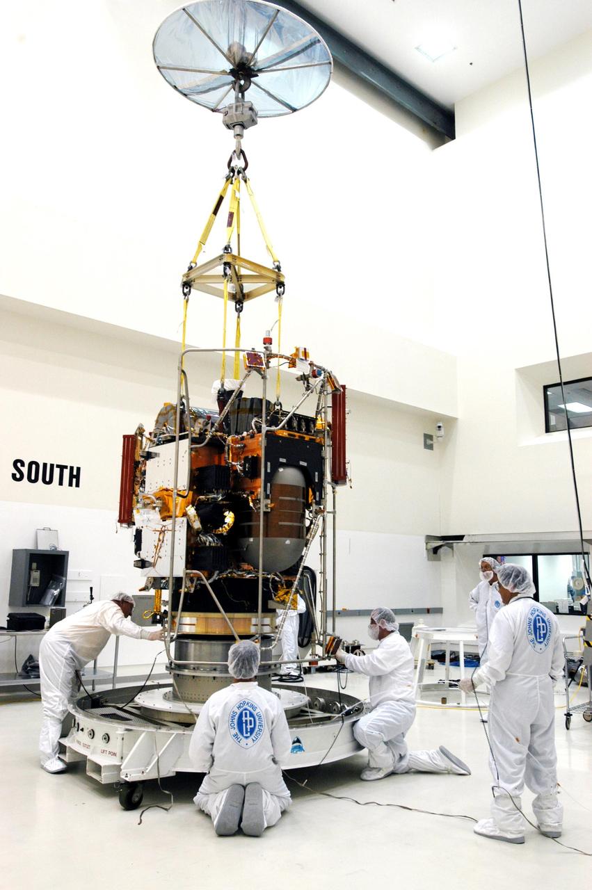 KENNEDY SPACE CENTER, FLA. - An overhead crane lifts the MESSENGER (Mercury Surface, Space Environment, Geochemistry and Ranging) spacecraft from its transporter inside the nonhazardous payload processing facility at Astrotech Space Operations in Titusville, Fla. Final assembly and testing will be completed at this facility. The spacecraft will return to the hazardous processing facility when ready for fueling, spin balance testing and mating to the upper stage. MESSENGER is scheduled to launch no earlier than July 30 from Cape Canaveral Air Force Station. MESSENGER is a scientific investigation of the planet Mercury, the least explored terrestrial planet. Understanding Mercury and how it was formed is essential to understanding the other terrestrial planets and their evolution. The MESSENGER mission will orbit Mercury after making two flybys of the planet, using data collected during the flybys as an initial guide to perform a more focused scientific investigation of this mysterious world. The spacecraft will enter Mercury orbit in March 2011 and carry out comprehensive measurements for one full Earth year.