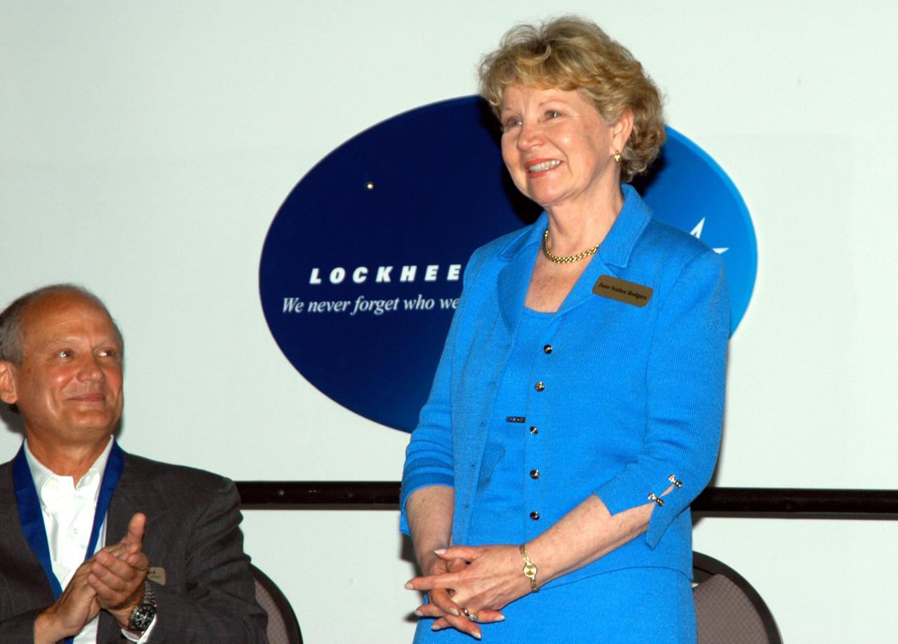 KENNEDY SPACE CENTER, FLA. -- At the Kennedy Space Center Visitor Complex, the late Francis R. "Dick" Scobee, commander of the ill-fated 1986 Challenger mission, is represented by his widow, June Scobee (right), at his induction into the U.S. Astronaut Hall of Fame. Another inductee, Dr. Norman E. Thagard (left), offers his encouragement. Also chosen for this honor in 2004 are Kathryn D. Sullivan, the first American woman to walk in space; Richard O. Covey, commander of the Hubble Space Telescope repair mission; Frederick D. Gregory, the first African-American to command a space mission; and Thagard, the first American to occupy Russia's Mir space station. The U.S. Astronaut Hall of Fame opened in 1990 to provide a place where space travelers could be remembered for their participation and accomplishments in the U.S. space program. To be eligible for induction, an individual must have been a U.S. citizen, a NASA astronaut, and out of the active astronaut corps at least five years. The five inductees join 52 previously honored astronauts from the ranks of the Gemini, Apollo, Skylab, Apollo-Soyuz, and Space Shuttle programs.