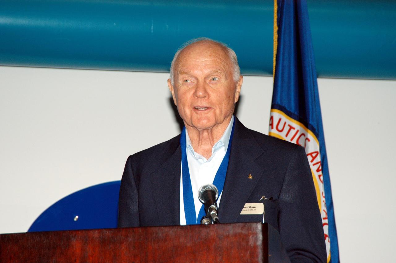 KENNEDY SPACE CENTER, FLA. -- At the Kennedy Space Center Visitor Complex, former NASA astronaut John H. Glenn Jr. participates in the 2004 U.S. Astronaut Hall of Fame induction ceremony. He is introducing inductee and fellow Ohioan Kathryn D. Sullivan, the first American woman to walk in space. Also chosen for this honor in 2004 are Richard O. Covey, commander of the Hubble Space Telescope repair mission; Frederick D. Gregory, the first African-American to command a space mission; Norman E. Thagard, the first American to occupy Russia's Mir space station; and the late Francis R. "Dick" Scobee, commander of the ill-fated 1986 Challenger mission. The U.S. Astronaut Hall of Fame opened in 1990 to provide a place where space travelers could be remembered for their participation and accomplishments in the U.S. space program. To be eligible for induction, an individual must have been a U.S. citizen, a NASA astronaut, and out of the active astronaut corps at least five years. The five inductees join 52 previously honored astronauts from the ranks of the Gemini, Apollo, Skylab, Apollo-Soyuz, and Space Shuttle programs.