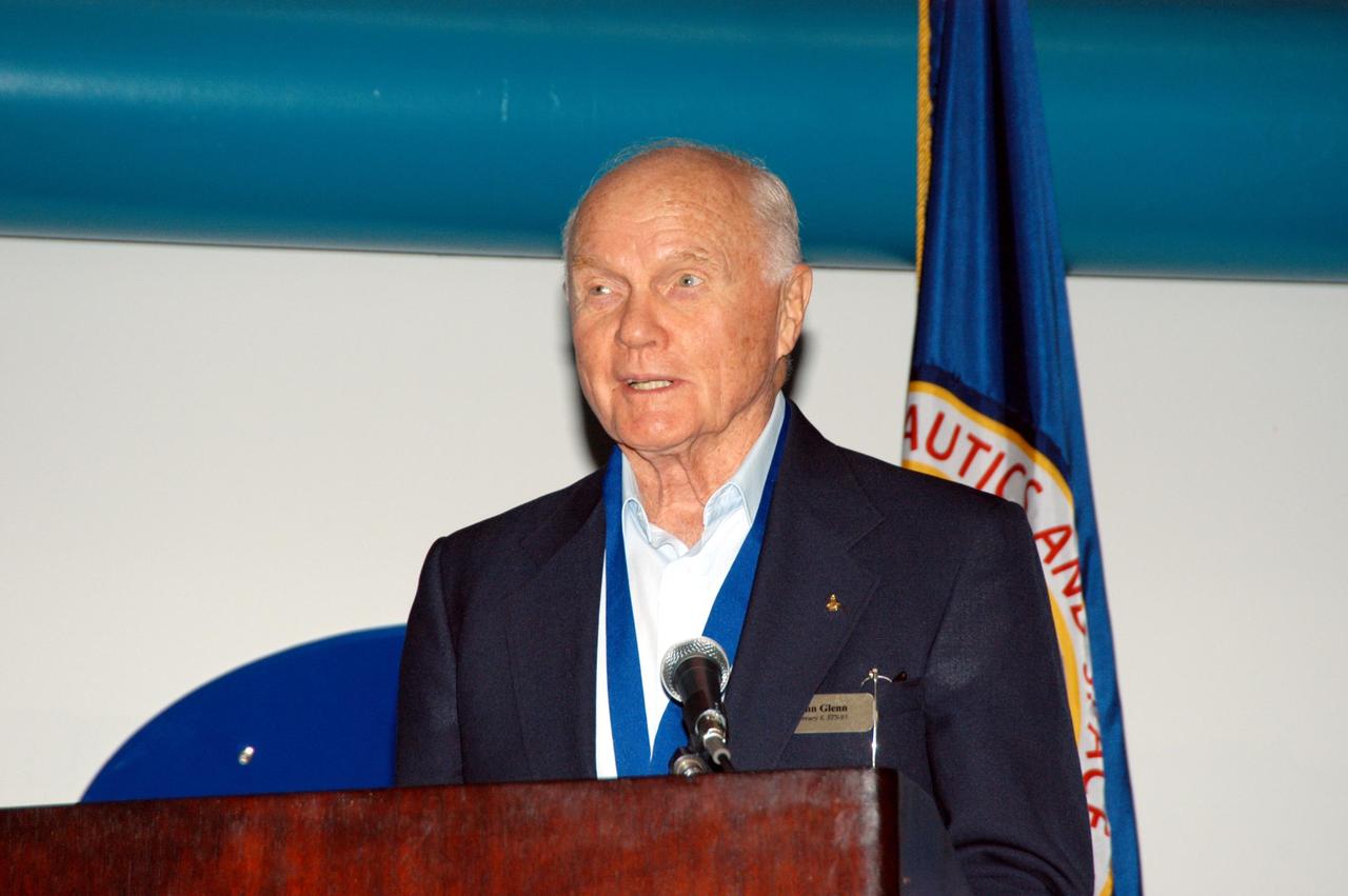 KENNEDY SPACE CENTER, FLA. -- At the Kennedy Space Center Visitor Complex, former NASA astronaut John H. Glenn Jr. participates in the 2004 U.S. Astronaut Hall of Fame induction ceremony. He is introducing inductee and fellow Ohioan Kathryn D. Sullivan, the first American woman to walk in space. Also chosen for this honor in 2004 are Richard O. Covey, commander of the Hubble Space Telescope repair mission; Frederick D. Gregory, the first African-American to command a space mission; Norman E. Thagard, the first American to occupy Russia's Mir space station; and the late Francis R. "Dick" Scobee, commander of the ill-fated 1986 Challenger mission. The U.S. Astronaut Hall of Fame opened in 1990 to provide a place where space travelers could be remembered for their participation and accomplishments in the U.S. space program. To be eligible for induction, an individual must have been a U.S. citizen, a NASA astronaut, and out of the active astronaut corps at least five years. The five inductees join 52 previously honored astronauts from the ranks of the Gemini, Apollo, Skylab, Apollo-Soyuz, and Space Shuttle programs.