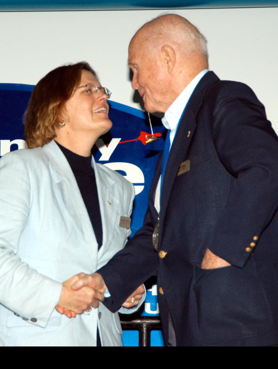 KENNEDY SPACE CENTER, FLA. -- At the Kennedy Space Center Visitor Complex, former NASA astronaut John H. Glenn Jr. (right) congratulates former NASA astronaut and fellow Ohioan Kathryn D. Sullivan on her induction into the U.S. Astronaut Hall of Fame. Sullivan was the first American woman to walk in space. Also chosen for this honor in 2004 are Richard O. Covey, commander of the Hubble Space Telescope repair mission; Frederick D. Gregory, the first African-American to command a space mission; Norman E. Thagard, the first American to occupy Russia's Mir space station; and the late Francis R. "Dick" Scobee, commander of the ill-fated 1986 Challenger mission. The U.S. Astronaut Hall of Fame opened in 1990 to provide a place where space travelers could be remembered for their participation and accomplishments in the U.S. space program. To be eligible for induction, an individual must have been a U.S. citizen, a NASA astronaut, and out of the active astronaut corps at least five years. The five inductees join 52 previously honored astronauts from the ranks of the Gemini, Apollo, Skylab, Apollo-Soyuz, and Space Shuttle programs.