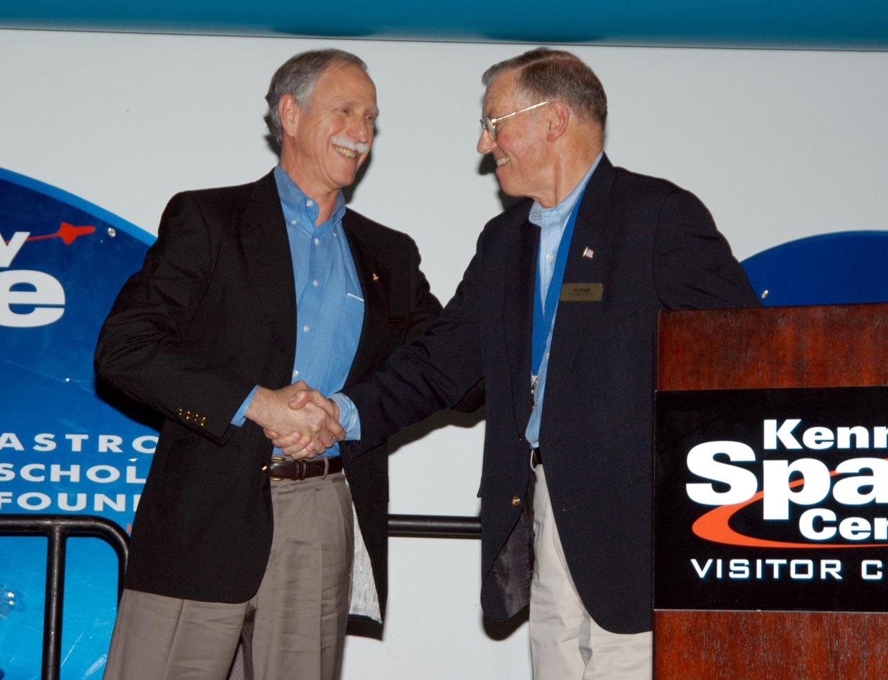KENNEDY SPACE CENTER, FLA. -- At the Kennedy Space Center Visitor Complex, former NASA astronaut Joe H. Engle (right) congratulates Richard O. Covey, commander of the Hubble Space Telescope repair mission, on his induction into the U.S. Astronaut Hall of Fame. Also chosen for this honor in 2004 are Kathryn D. Sullivan, the first American woman to walk in space; Frederick D. Gregory, the first African-American to command a space mission; Norman E. Thagard, the first American to occupy Russia's Mir space station; and the late Francis R. "Dick" Scobee, commander of the ill-fated 1986 Challenger mission. The U.S. Astronaut Hall of Fame opened in 1990 to provide a place where space travelers could be remembered for their participation and accomplishments in the U.S. space program. To be eligible for induction, an individual must have been a U.S. citizen, a NASA astronaut, and out of the active astronaut corps at least five years. The five inductees join 52 previously honored astronauts from the ranks of the Gemini, Apollo, Skylab, Apollo-Soyuz, and Space Shuttle programs.