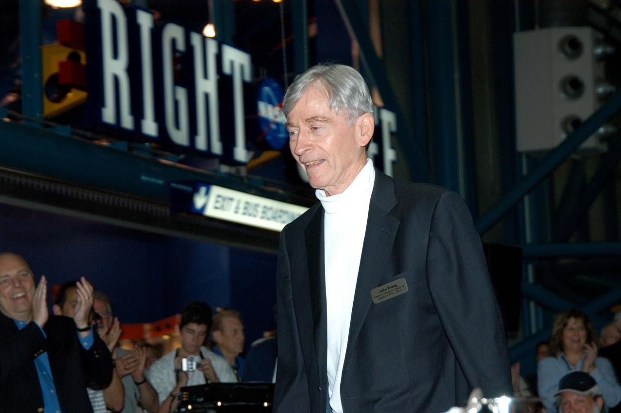 KENNEDY SPACE CENTER, FLA. --  Before the induction ceremony of five space program heroes into the U.S. Astronaut Hall of Fame, astronaut John Young is warmly greeted as he is introduced as a previous inductee.  Co-holder of a record for the most space flights, six, he flew on Gemini 3 and 10, orbited the Moon on Apollo 10, walked on the Moon on Apollo 16, and commanded two space shuttle missions, STS-1 and STS-9.  Young currently serves as associate director, technical, at  Johnson Space Center. The induction ceremony was held at the Apollo/Saturn V Center at KSC.  New inductees are Richard O. Covey, commander of the Hubble Space Telescope repair mission; Norman E. Thagard, the first American to occupy Russia’s Mir space station; the late Francis R. "Dick" Scobee, commander of the ill-fated 1986 Challenger mission; Kathryn D. Sullivan, the first American woman to walk in space; and Frederick D. Gregory, the first African-American to command a space mission and the current NASA deputy administrator. The U.S. Astronaut Hall of Fame opened in 1990 to provide a place where space travelers could be remembered for their participation and accomplishments in the U.S. space program. The five inductees join 52 previously honored astronauts from the ranks of the Gemini, Apollo, Skylab, Apollo-Soyuz, and Space Shuttle programs.