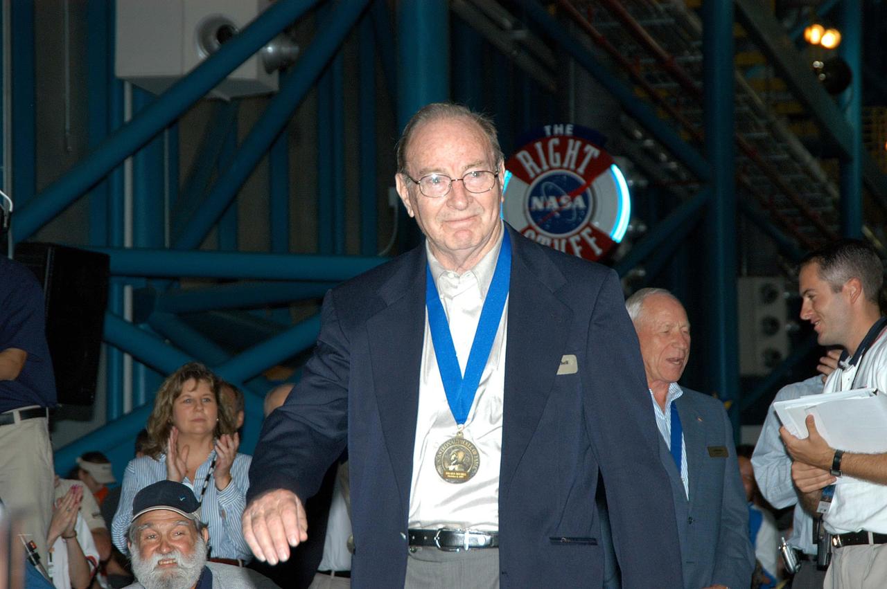KENNEDY SPACE CENTER, FLA. --  Before the induction ceremony of five space program heroes into the U.S. Astronaut Hall of Fame, former astronaut Ed Mitchell is introduced as a previous inductee.  Mitchell explored the Moon's hilly Fra Mauro region with Alan B. Shepard during the 1971 Apollo 14 mission. The ceremony was held at the Apollo/Saturn V Center at KSC.  New inductees are Richard O. Covey, commander of the Hubble Space Telescope repair mission; Norman E. Thagard, the first American to occupy Russia’s Mir space station; the late Francis R. "Dick" Scobee, commander of the ill-fated 1986 Challenger mission; Kathryn D. Sullivan, the first American woman to walk in space; and Frederick D. Gregory, the first African-American to command a space mission and the current NASA deputy administrator. The U.S. Astronaut Hall of Fame opened in 1990 to provide a place where space travelers could be remembered for their participation and accomplishments in the U.S. space program. The five inductees join 52 previously honored astronauts from the ranks of the Gemini, Apollo, Skylab, Apollo-Soyuz, and Space Shuttle programs.